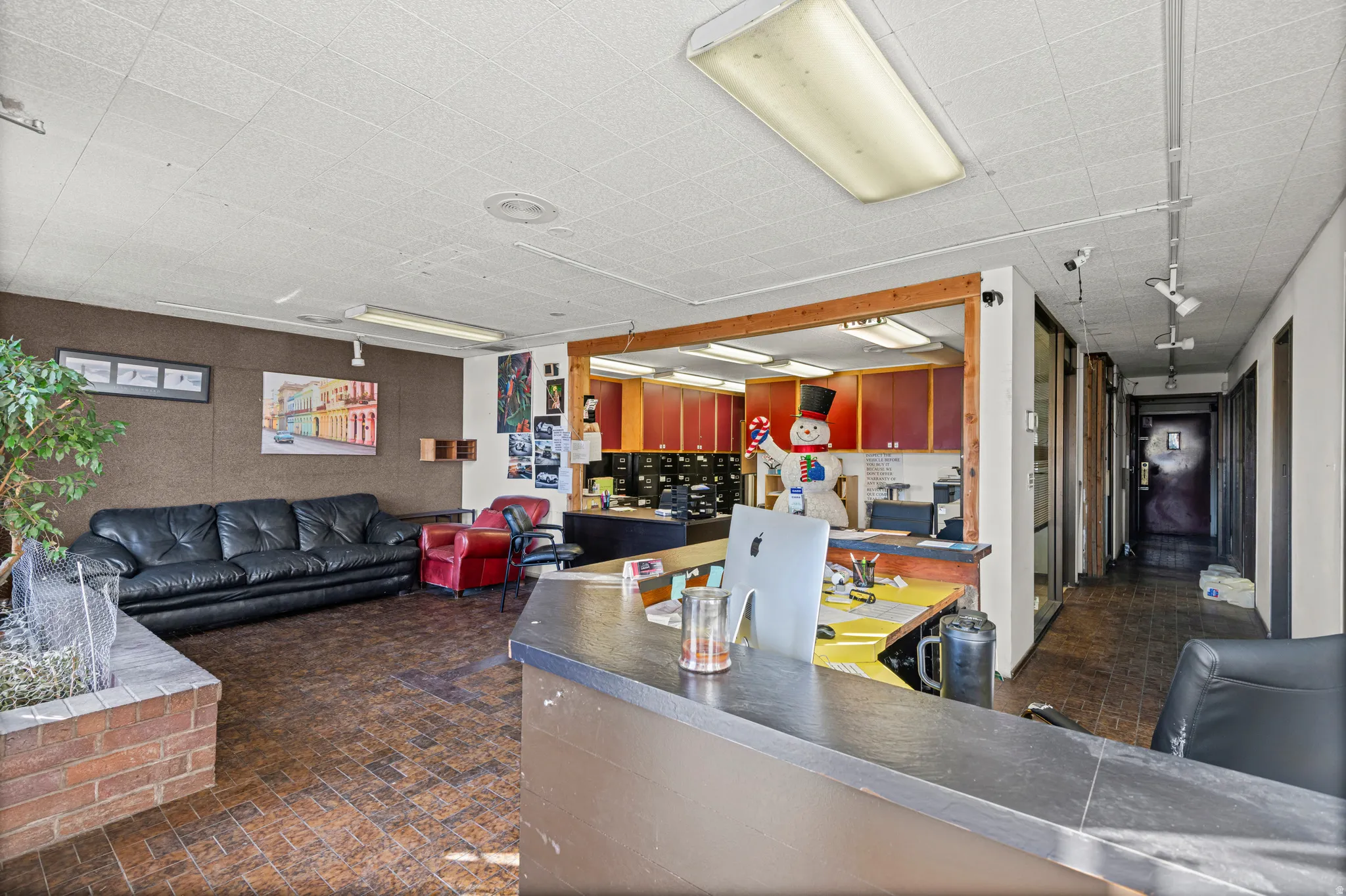 Interior space with open floor plan and dark countertops