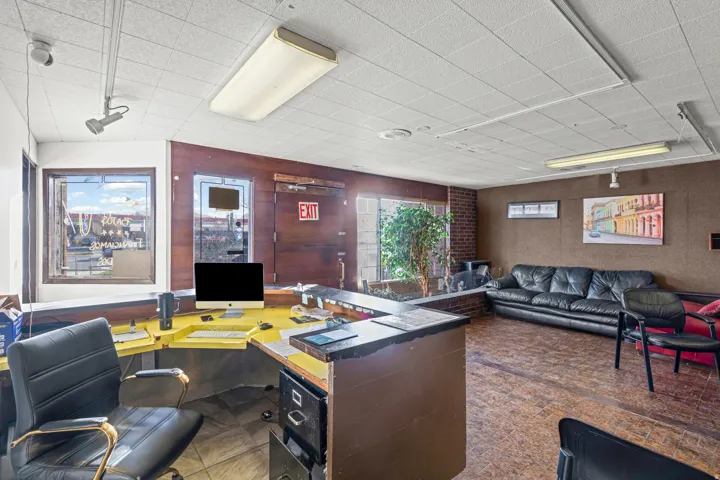 Office area with wooden walls