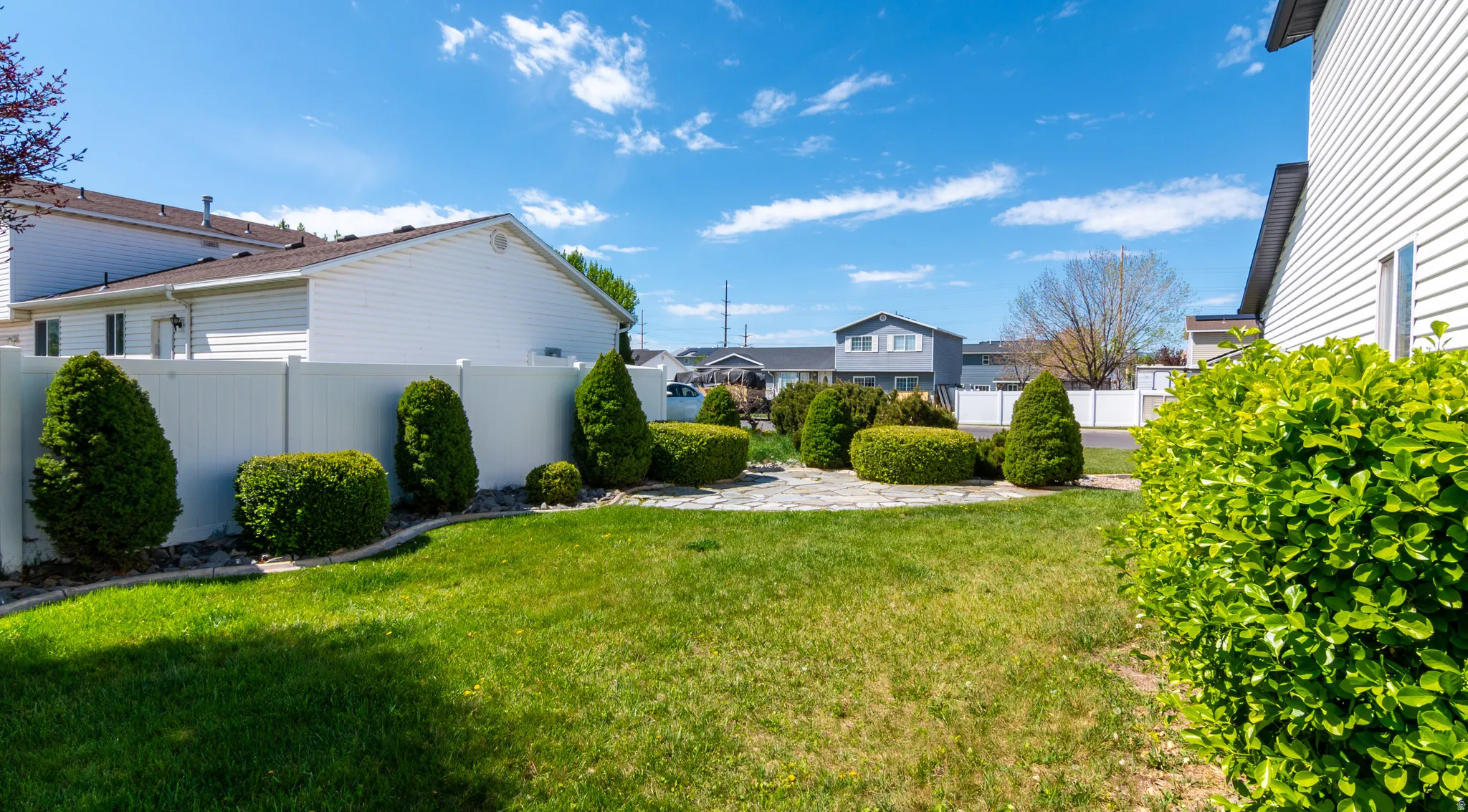 View of yard featuring a patio and a residential view