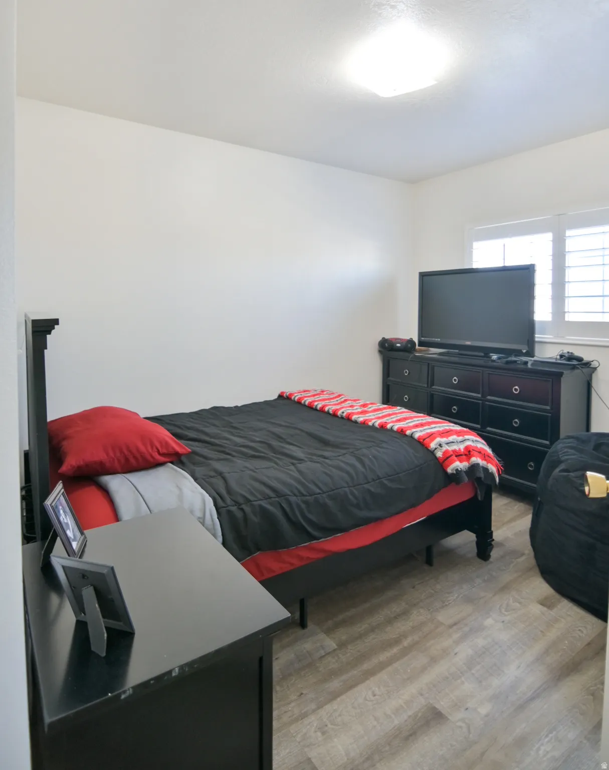 Bedroom with light wood-style floors