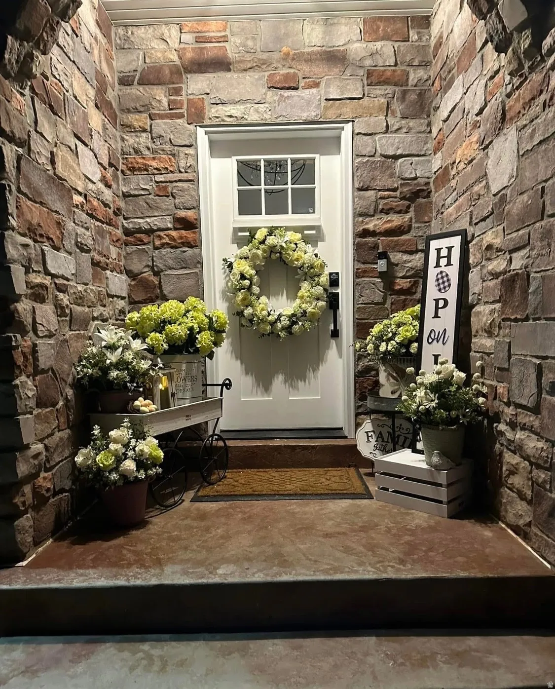 View of exterior entry featuring stone siding