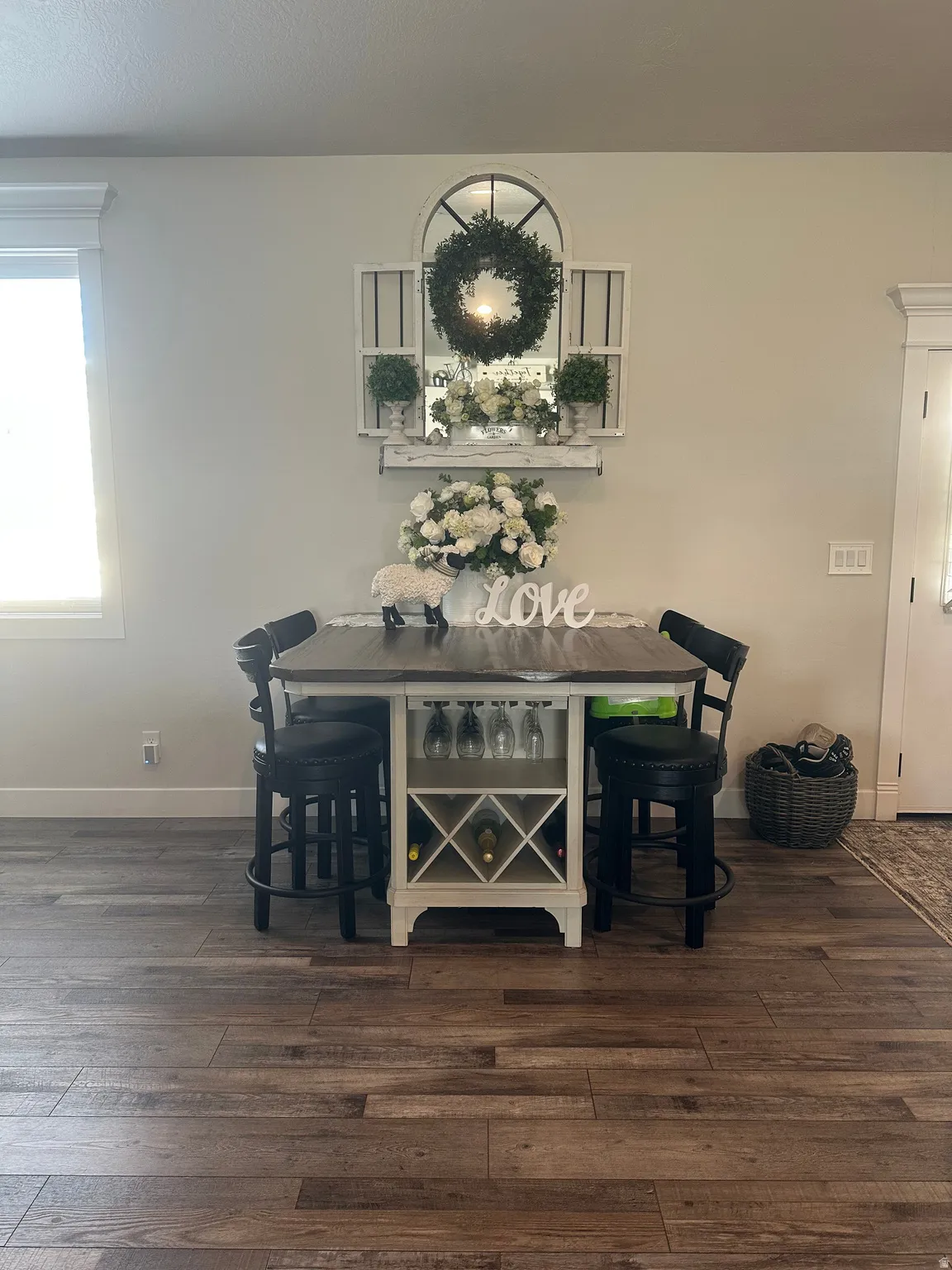 Dining area with dark wood-style floors