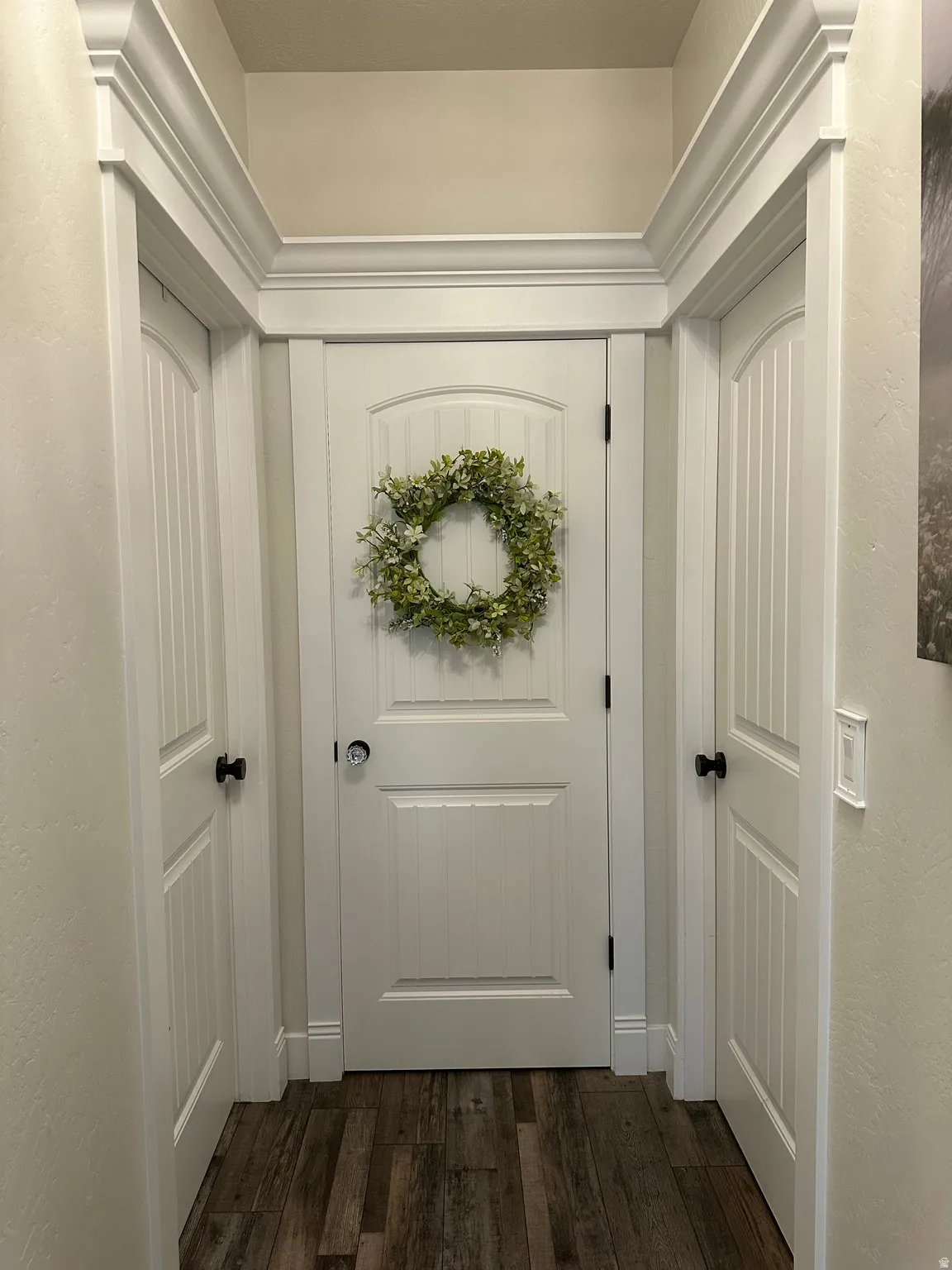 Doorway featuring hardwood / wood-style flooring