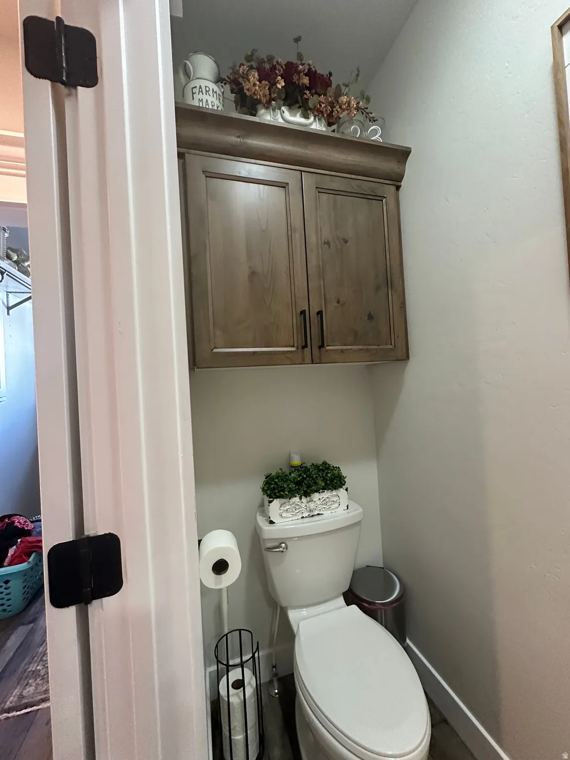 Bathroom featuring toilet and baseboards