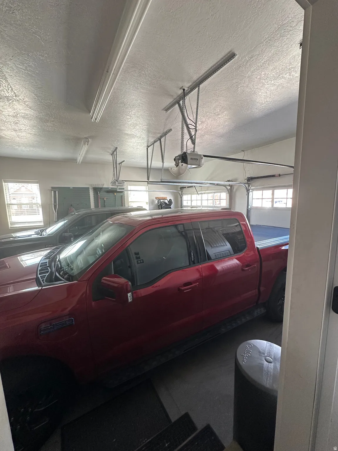 Garage featuring a garage door opener