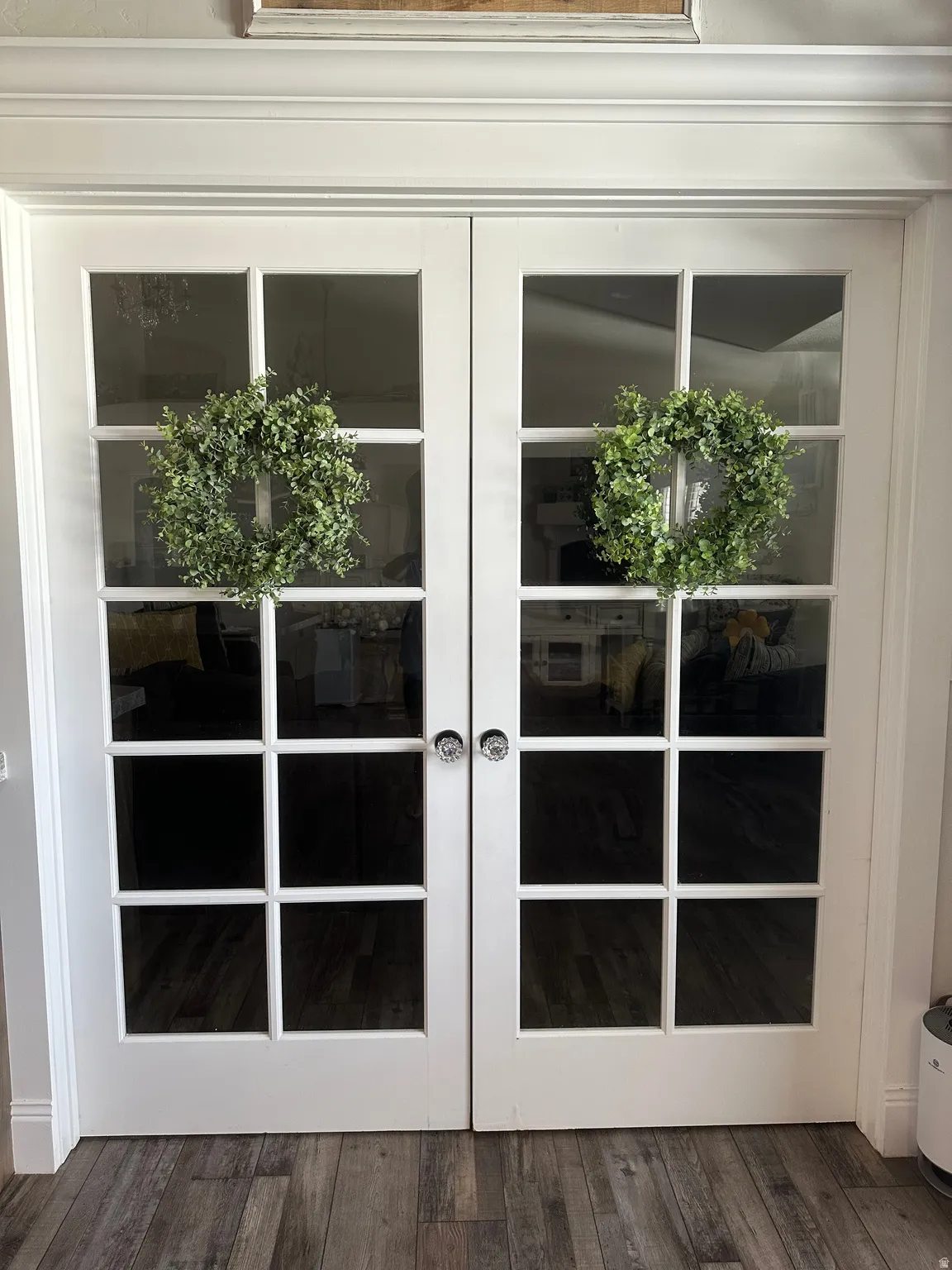 Property entrance featuring french doors