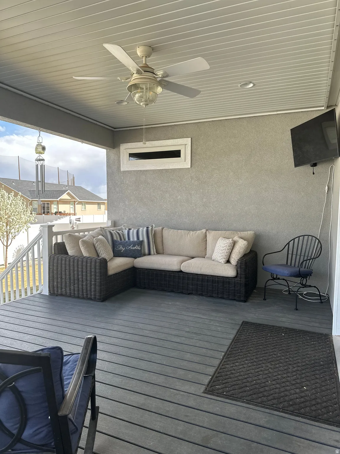 Deck featuring a ceiling fan and outdoor seating