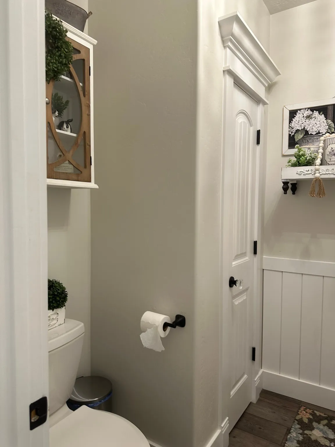 Bathroom featuring toilet and dark wood finished floors