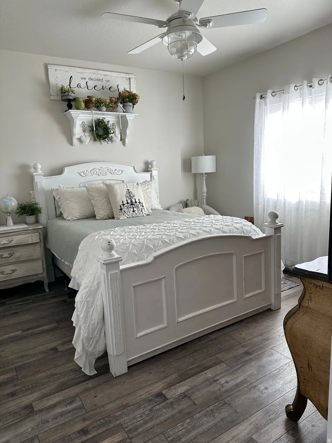 Bedroom with dark wood-type flooring and a ceiling fan
