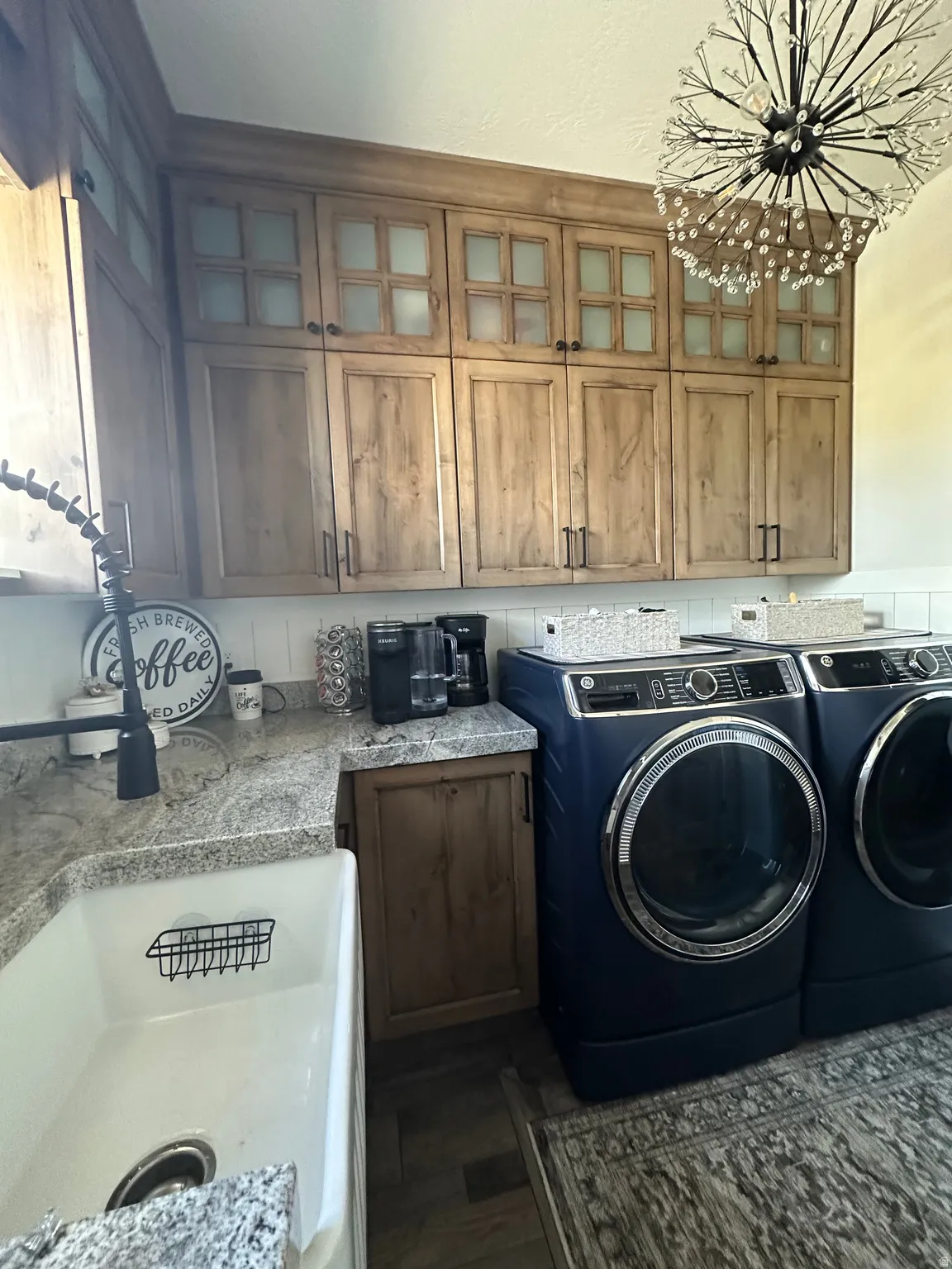 Laundry area featuring washing machine and dryer and cabinet space