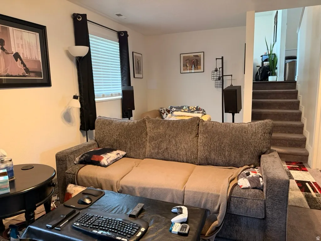 Living area featuring stairway