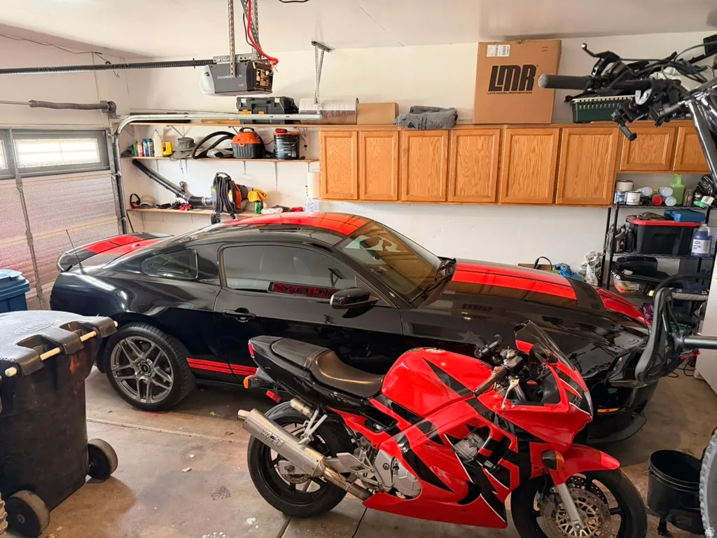 Garage featuring a garage door opener