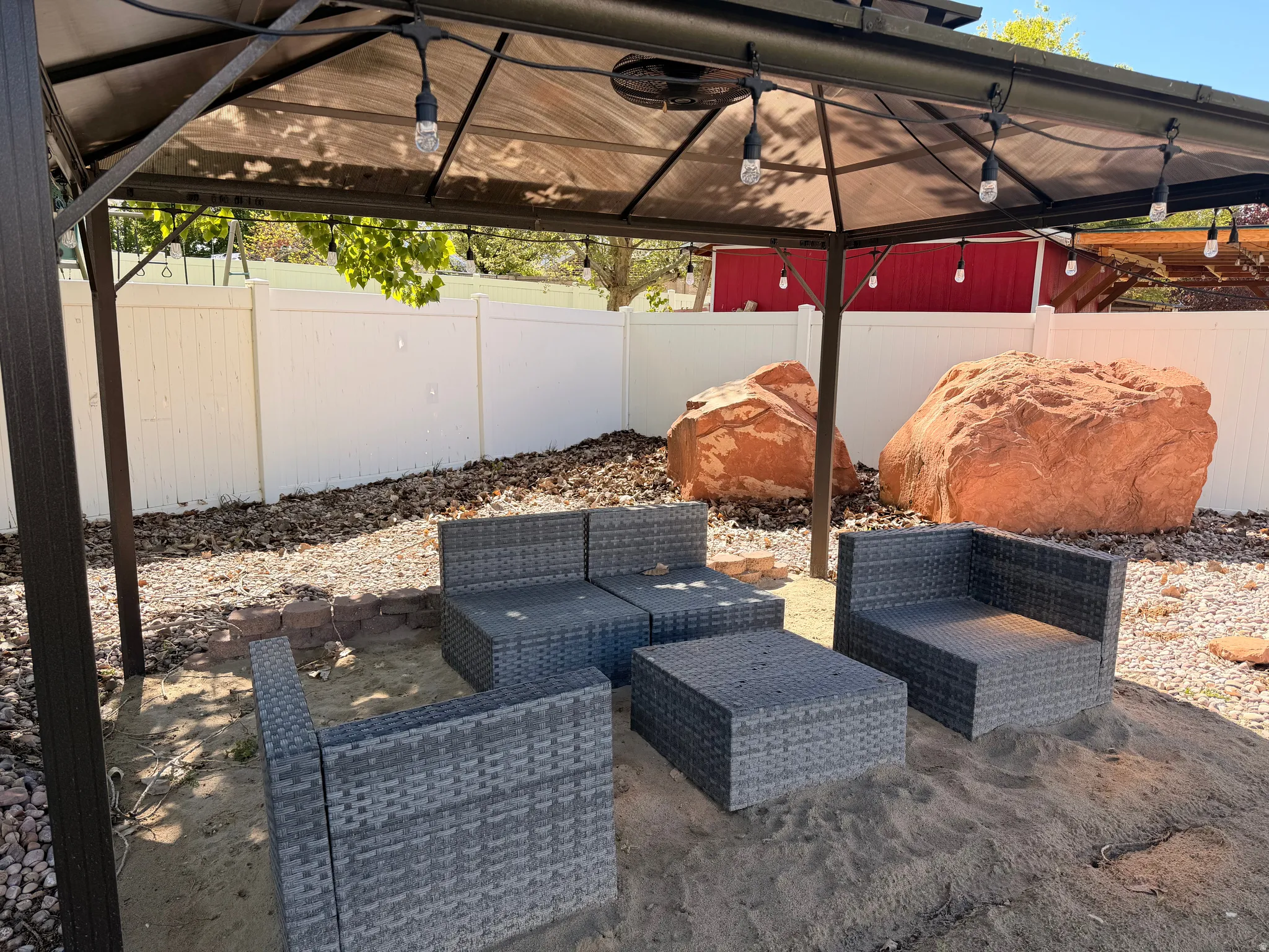 Fenced backyard featuring outdoor lounge area, a gazebo, and a patio area