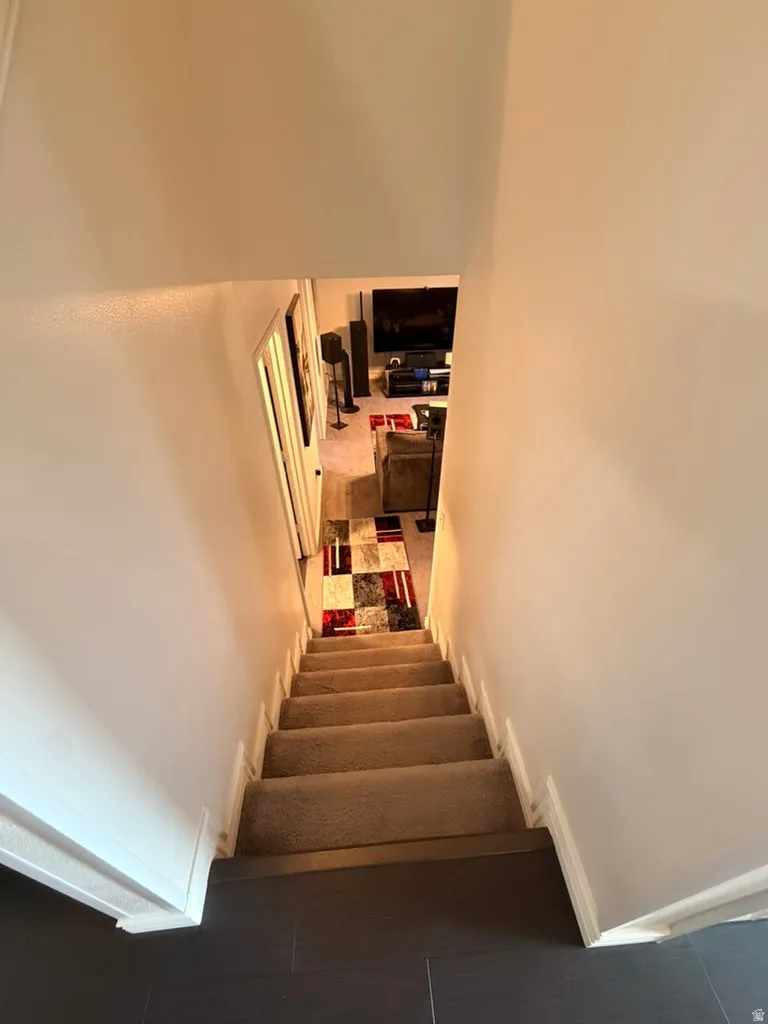 Stairs featuring baseboards