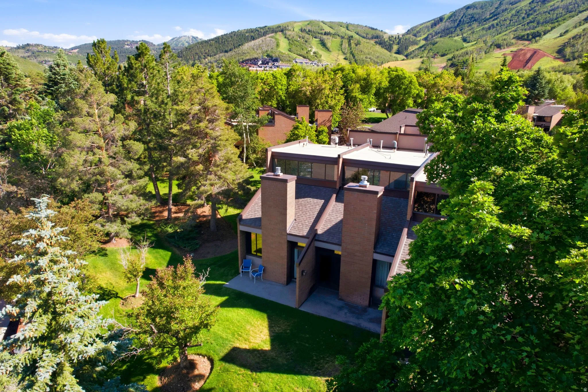 Multi-level property featuring brick and stucco siding