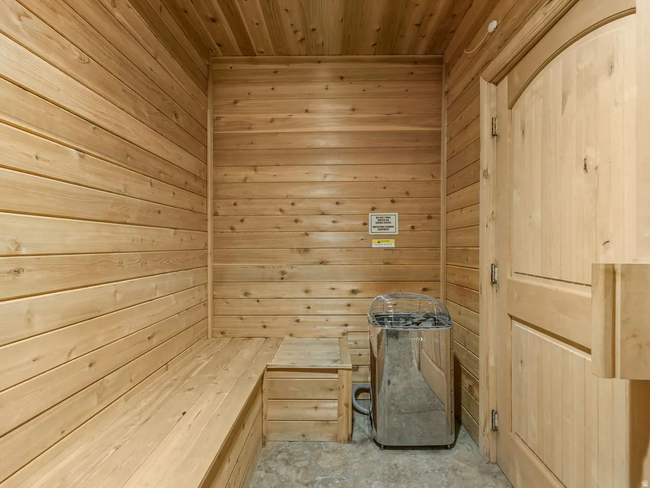 Relaxing sauna / steam room with wooden walls and wood ceiling