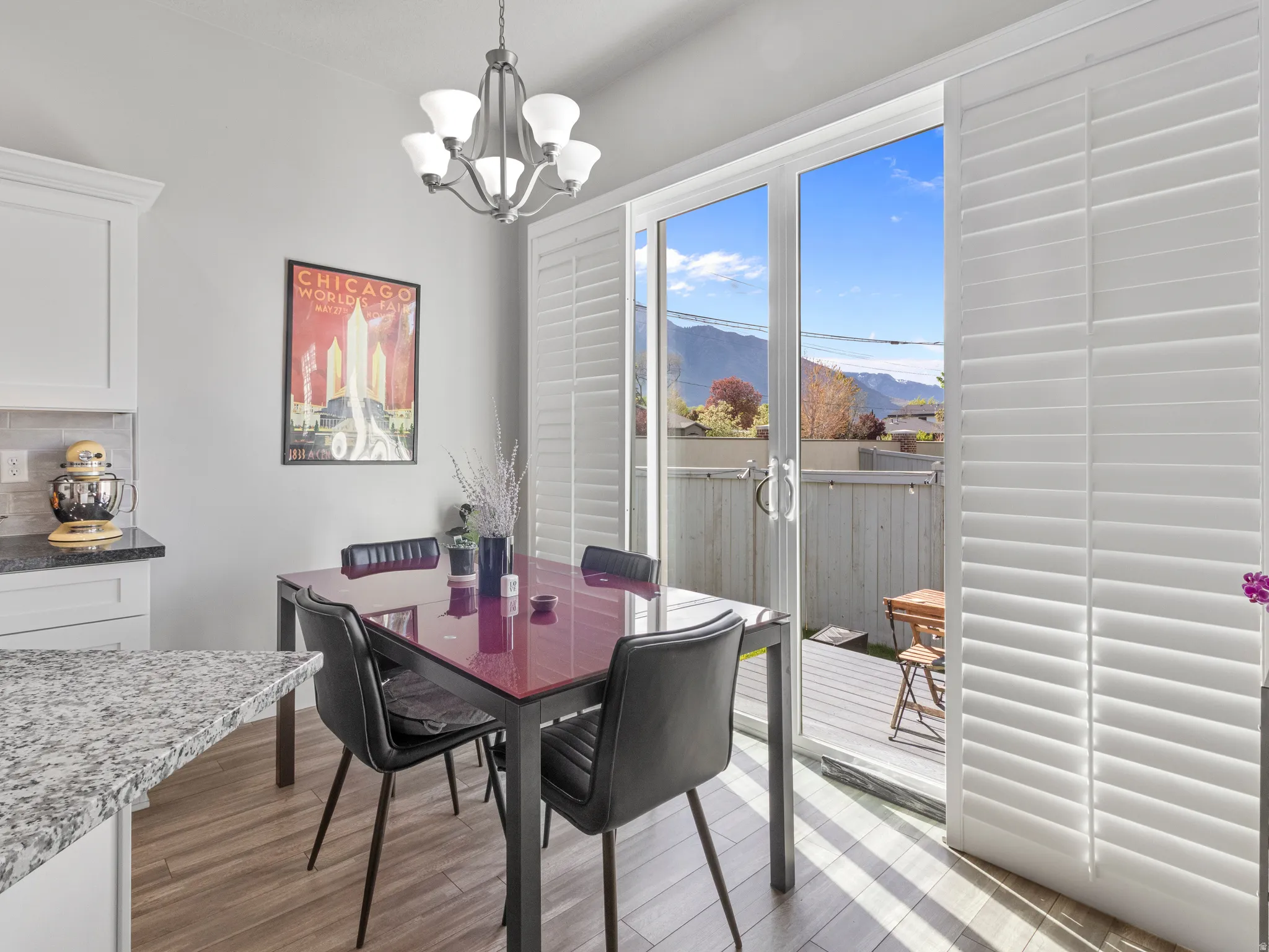Dining space featuring a mountain view and sliders to the rear deck.