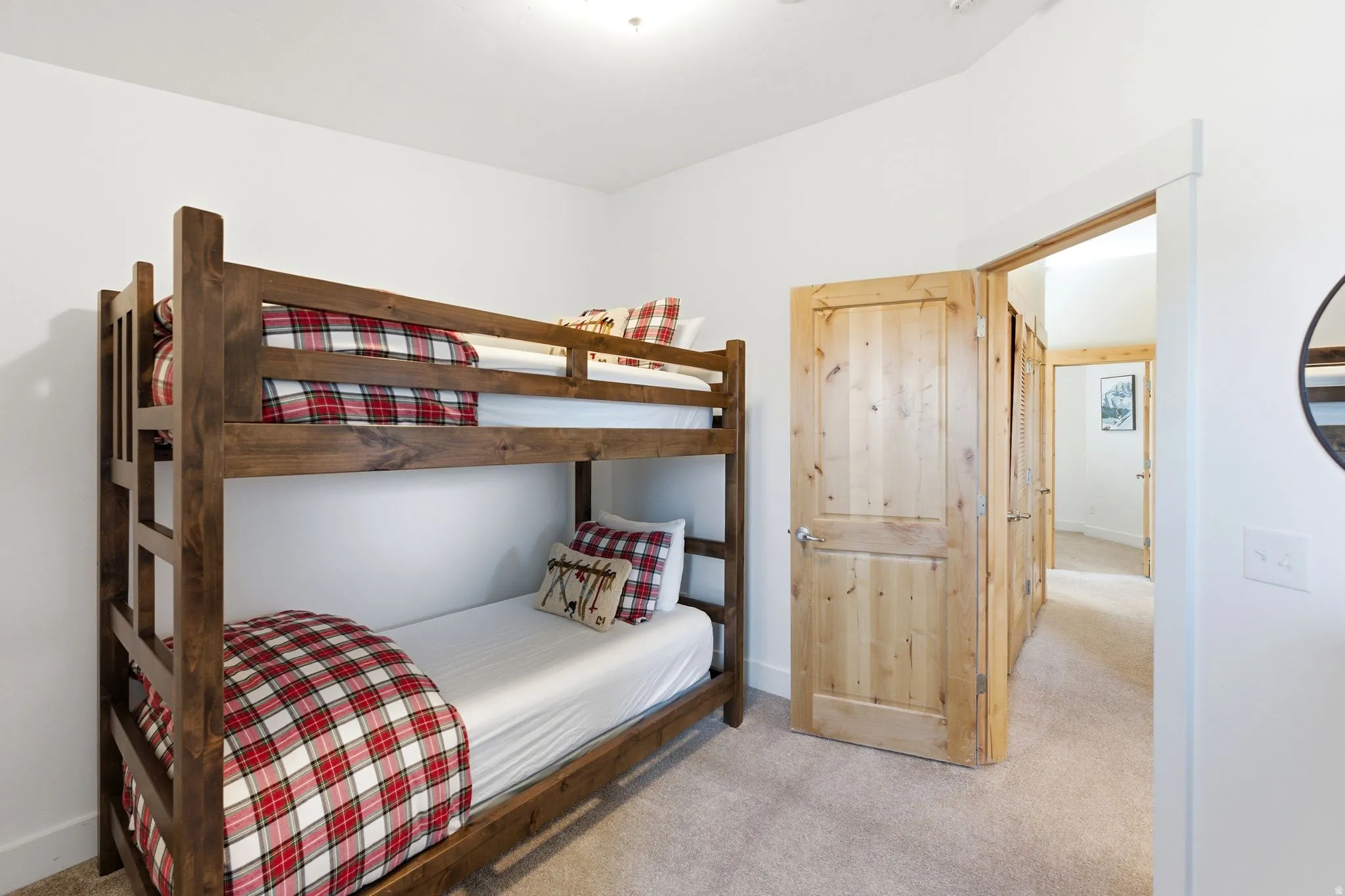 Bedroom with light colored carpet
