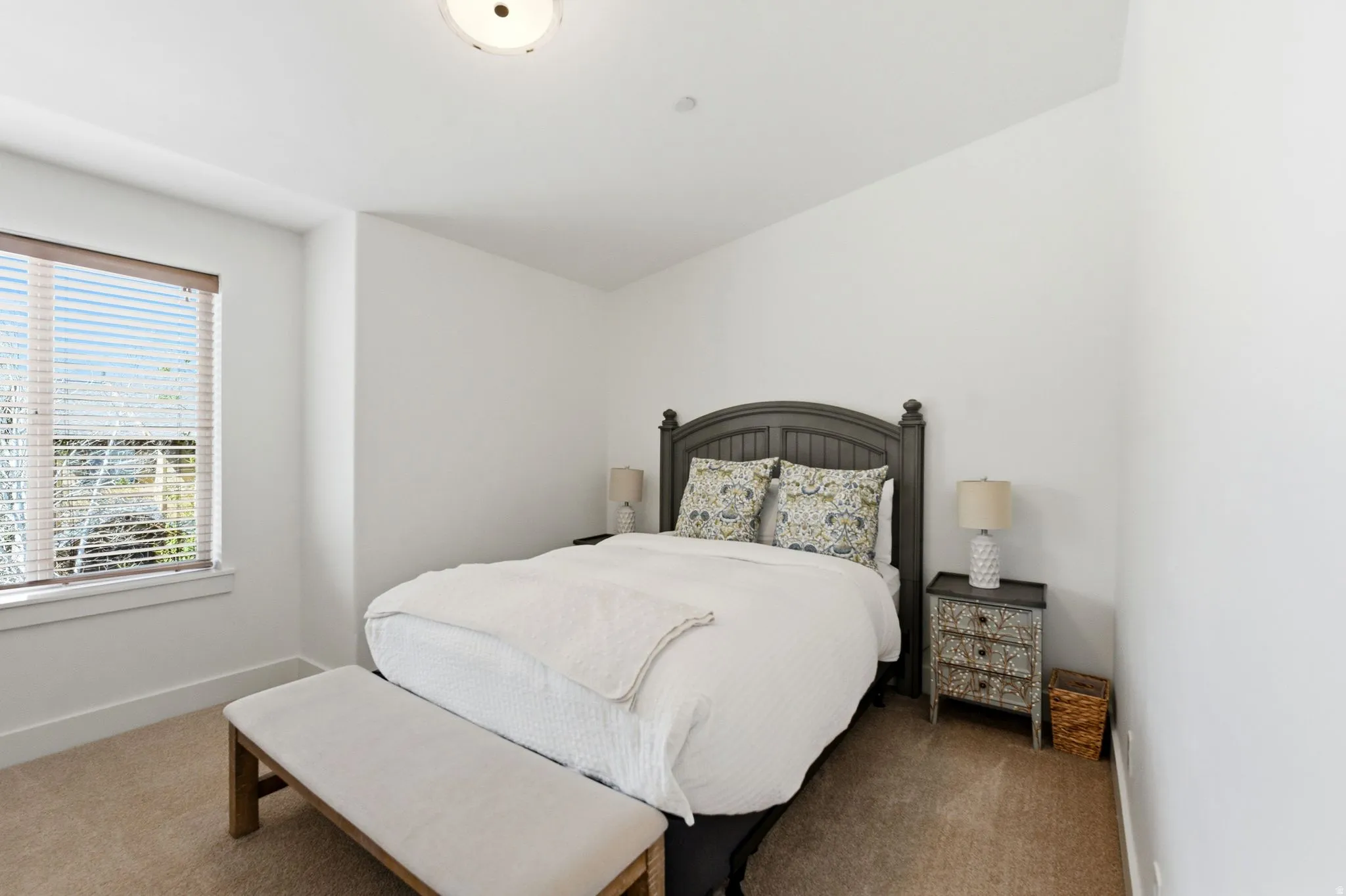 Carpeted bedroom with baseboards