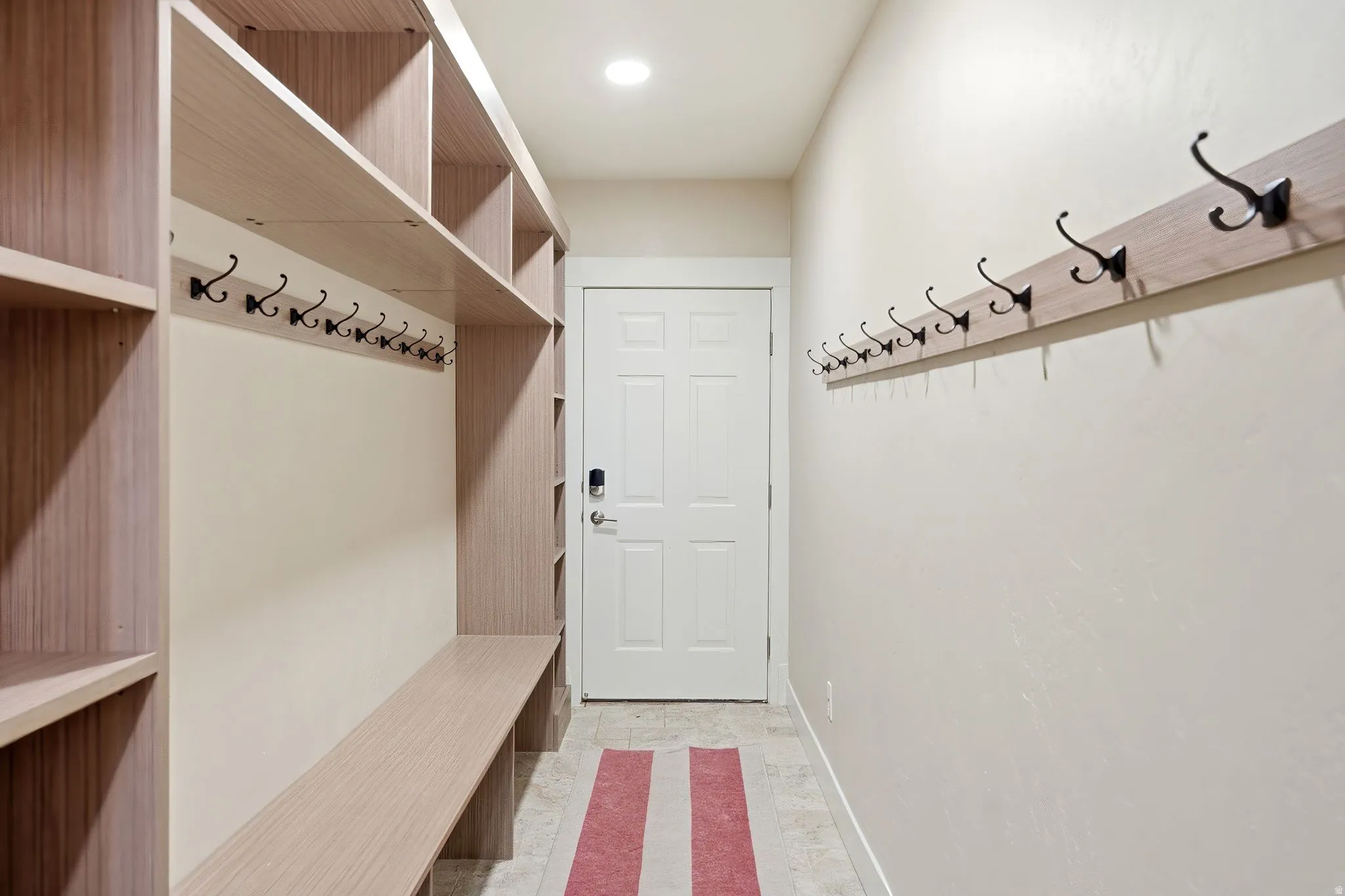 Mudroom with baseboards and recessed lighting
