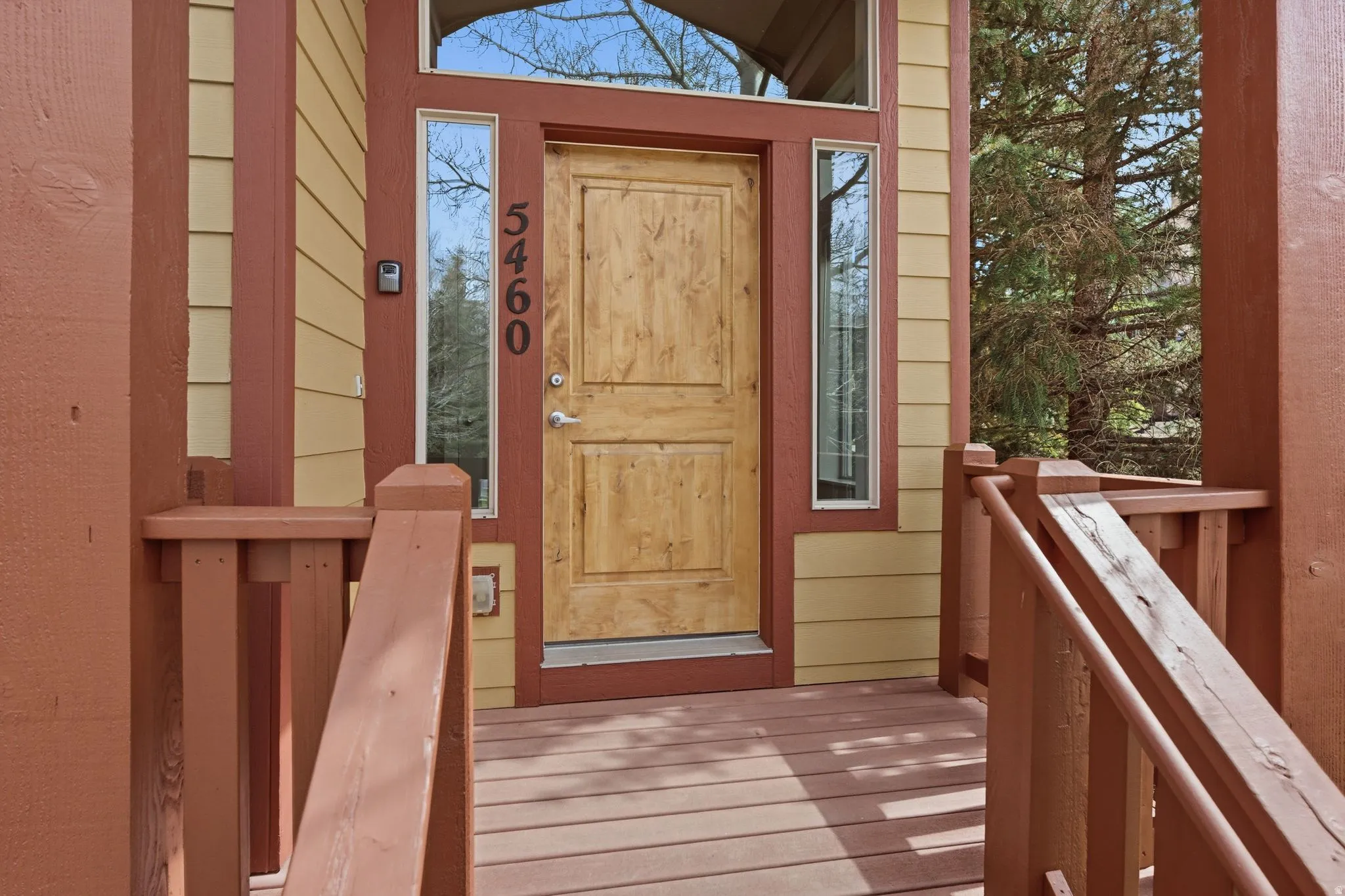 Doorway to property with a wooden deck