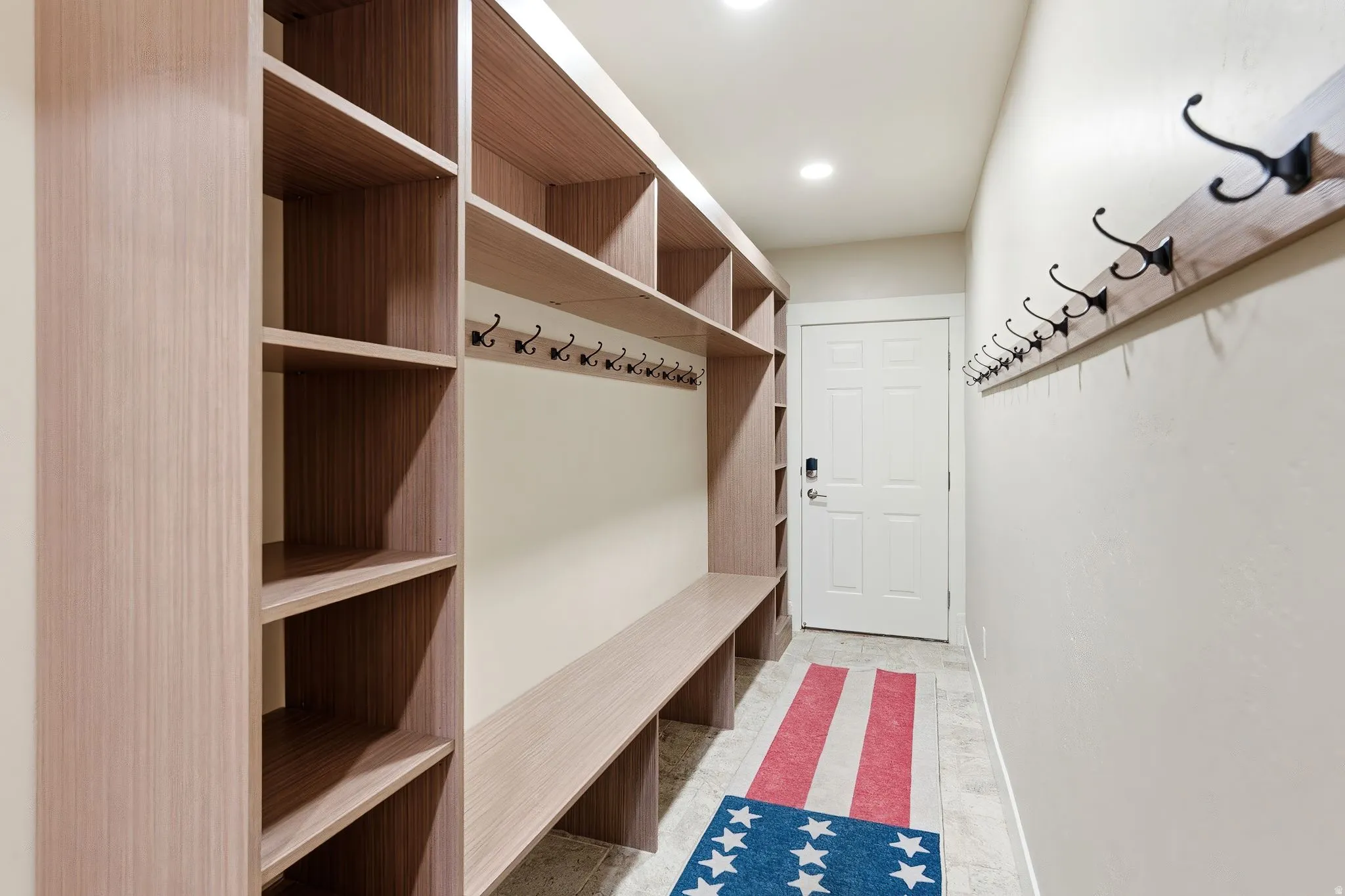 Mudroom featuring baseboards and recessed lighting