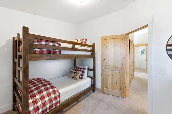 Bedroom with light colored carpet