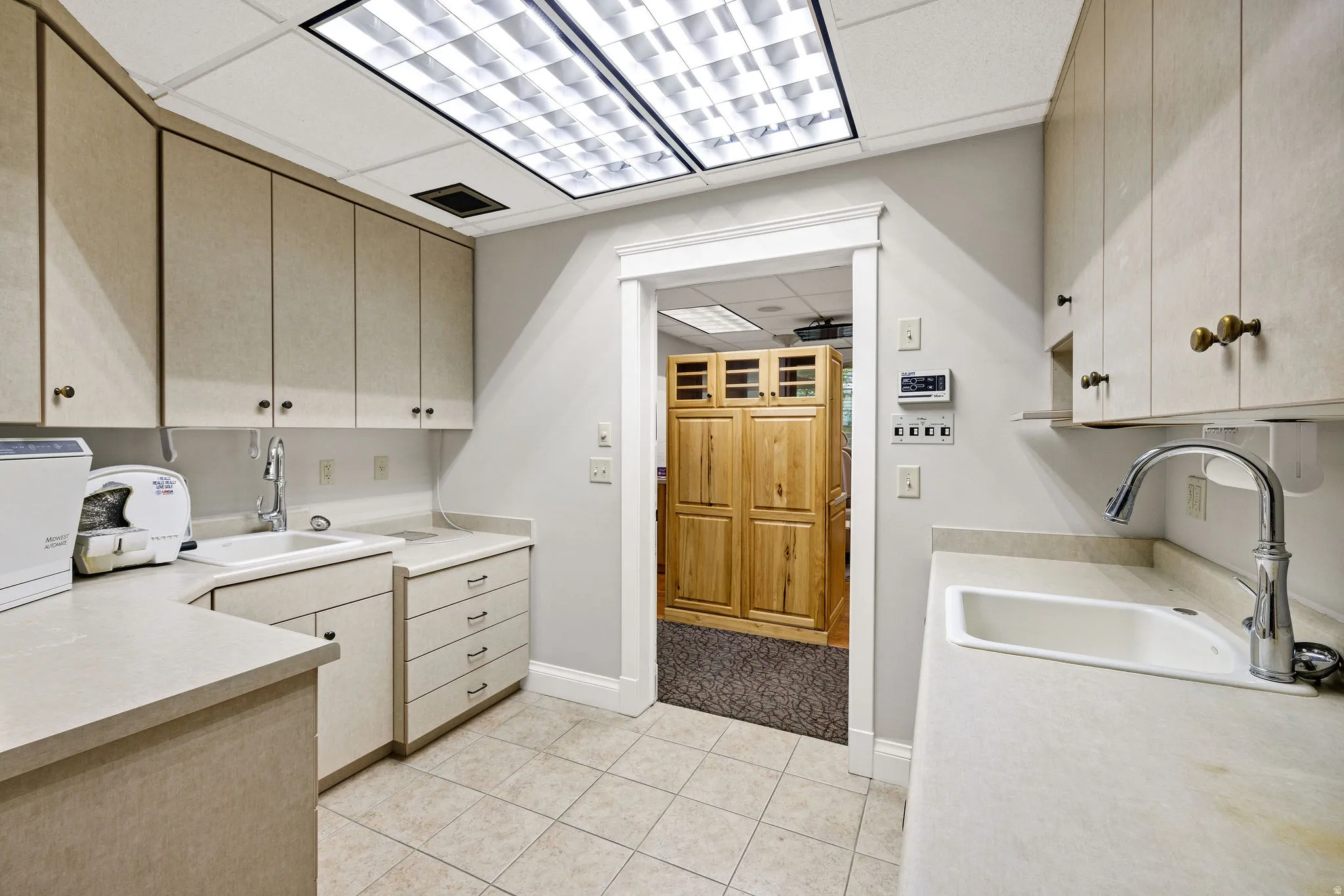 Lab room featuring a paneled ceiling and light tile patterned floors