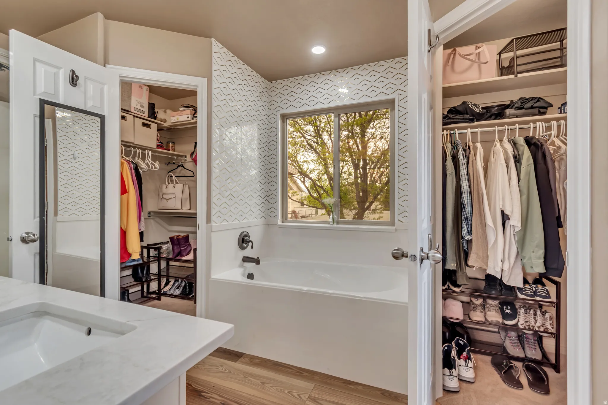 Full bath with two spacious walk-in closets.