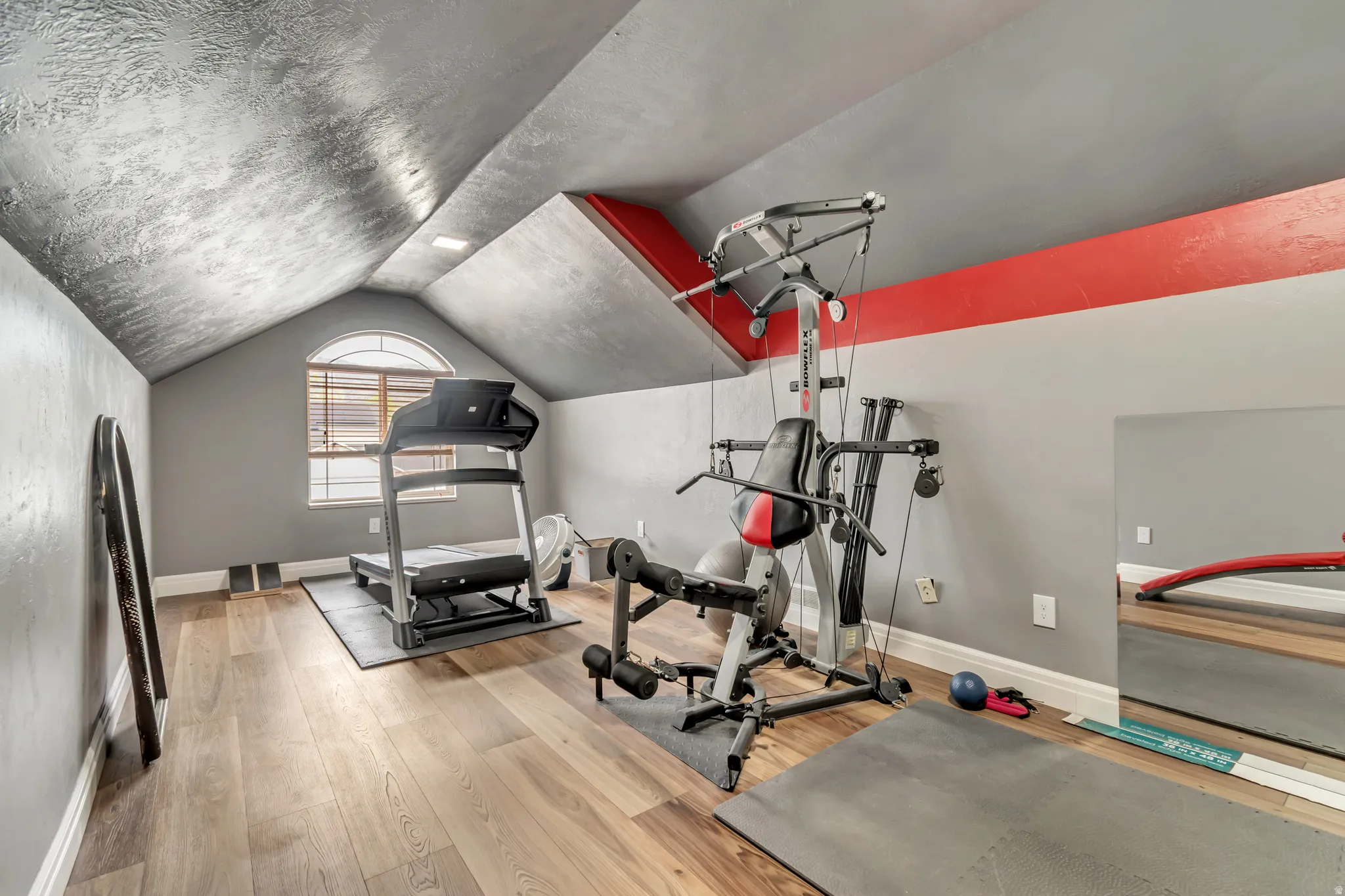 East-facing shot of the bonus/exercise room. Plenty of natural light in this space.