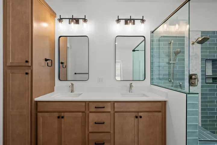 Bathroom with double vanity and a walk in shower
