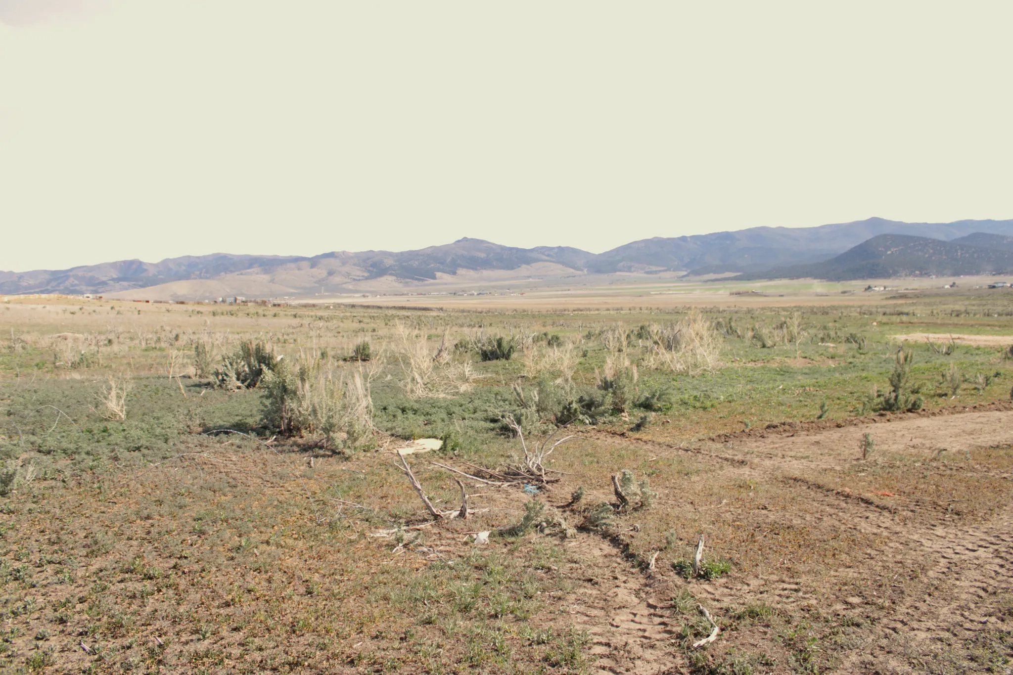 View of mountain backdrop with rural landscape
