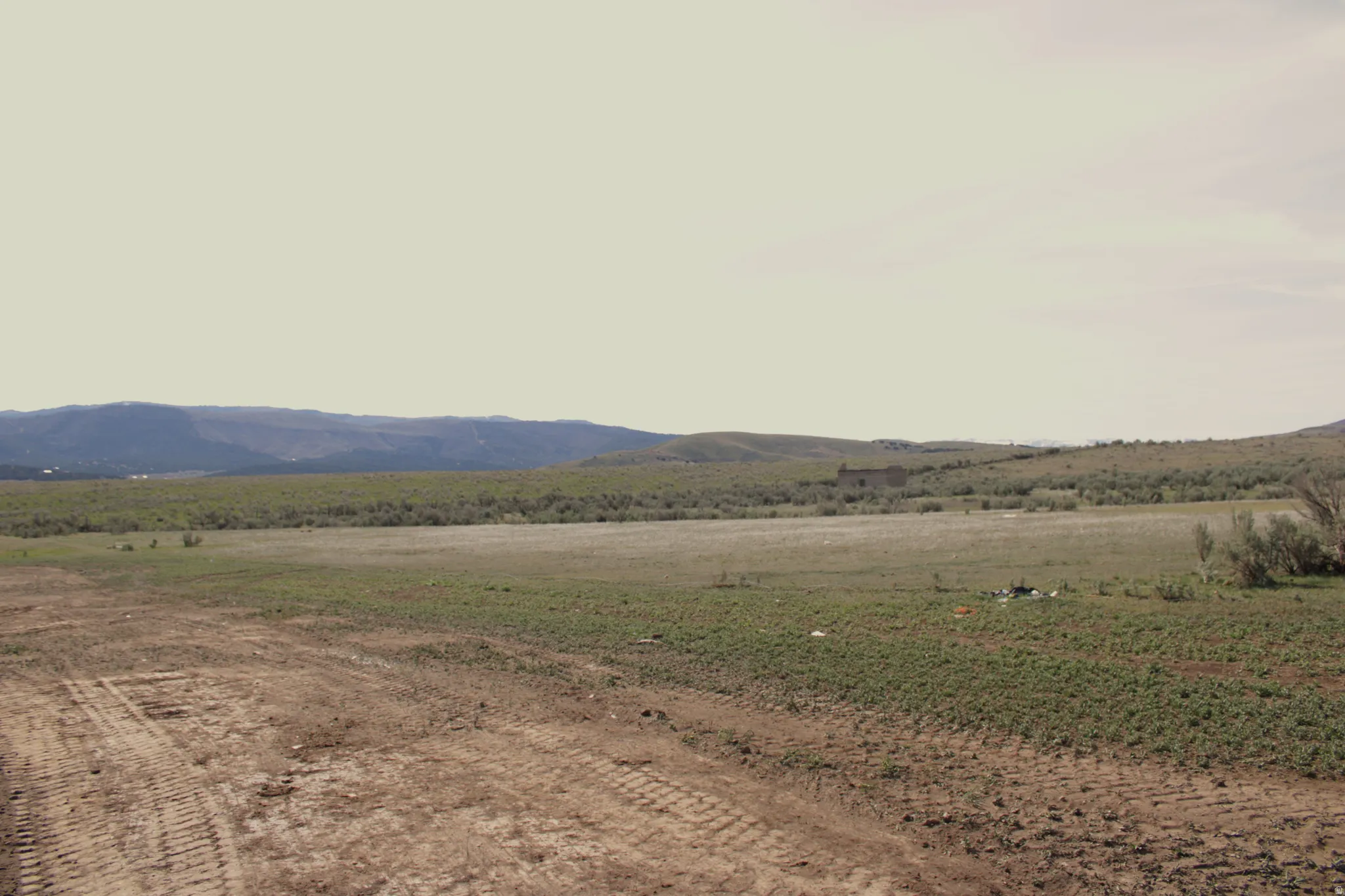 View of mountain background featuring rural landscape