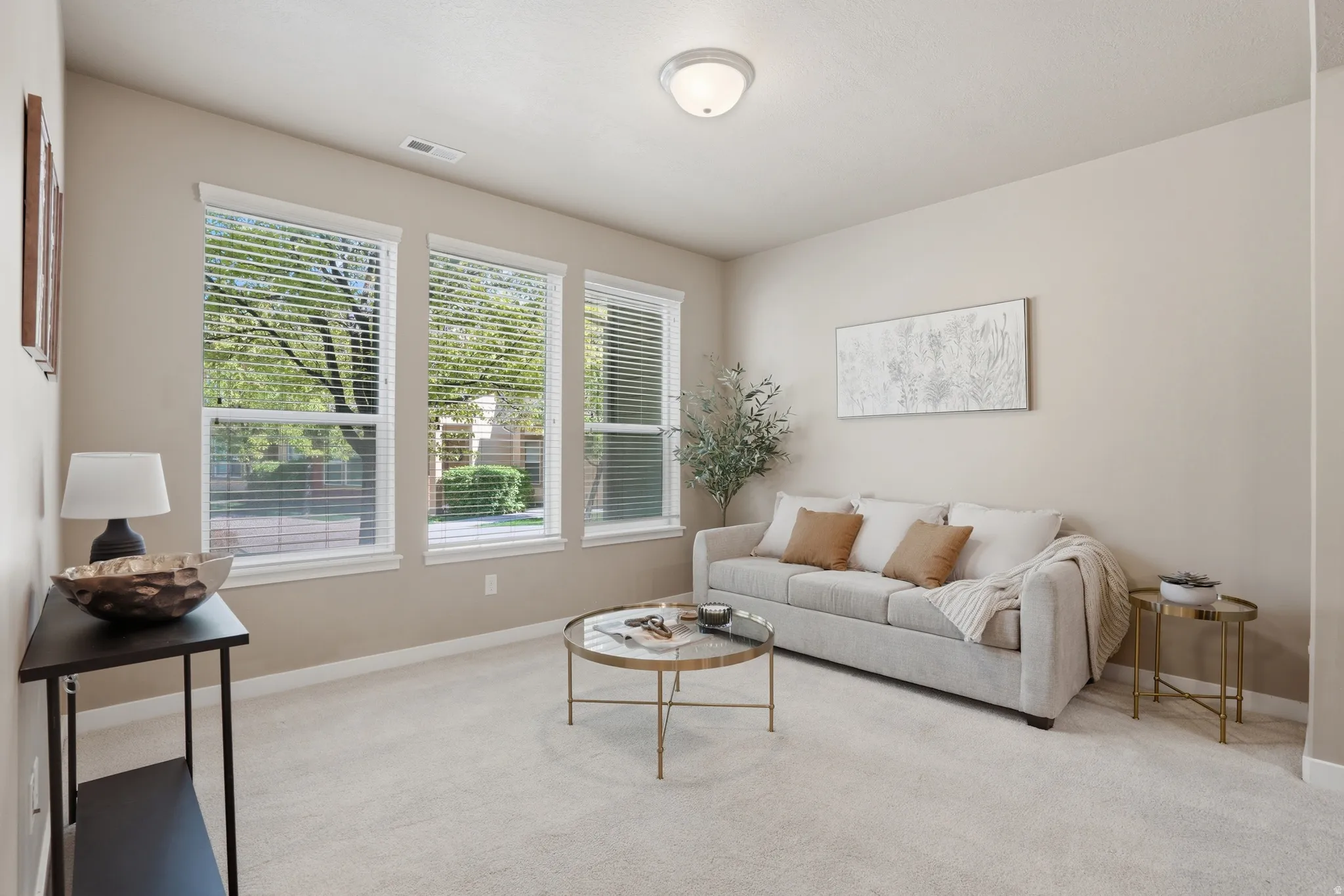 Living room featuring light carpet and baseboards