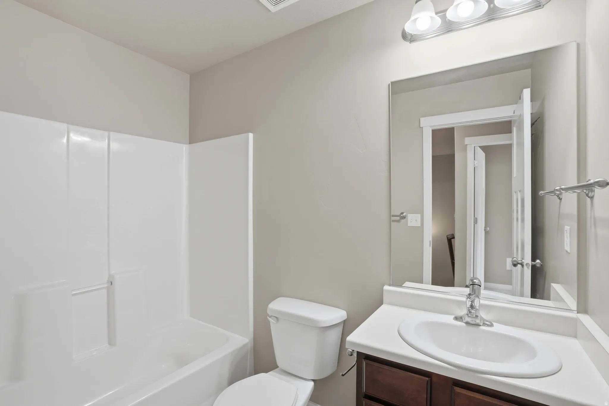 Full bathroom with vanity and shower / tub combination