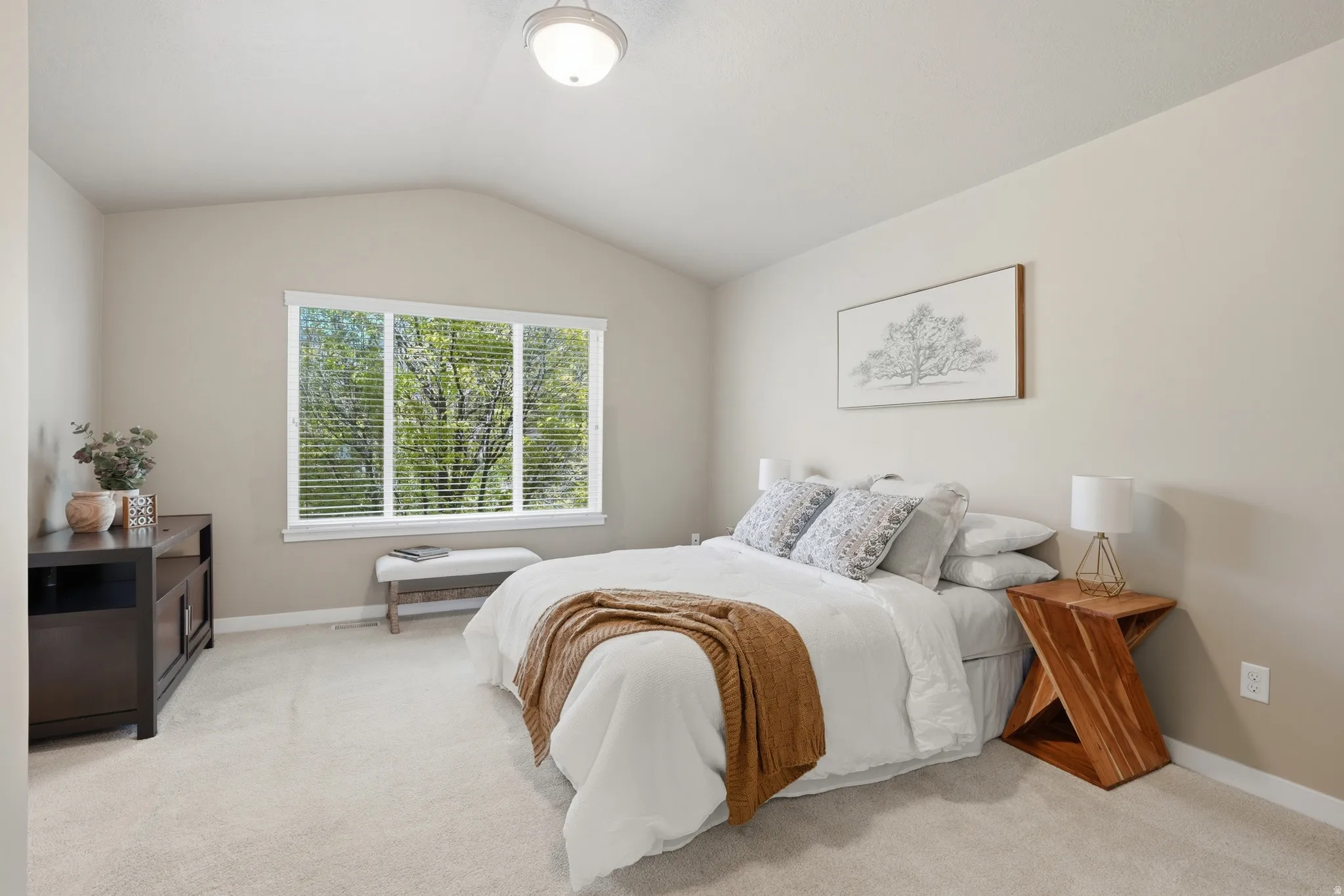 Bedroom with light carpet