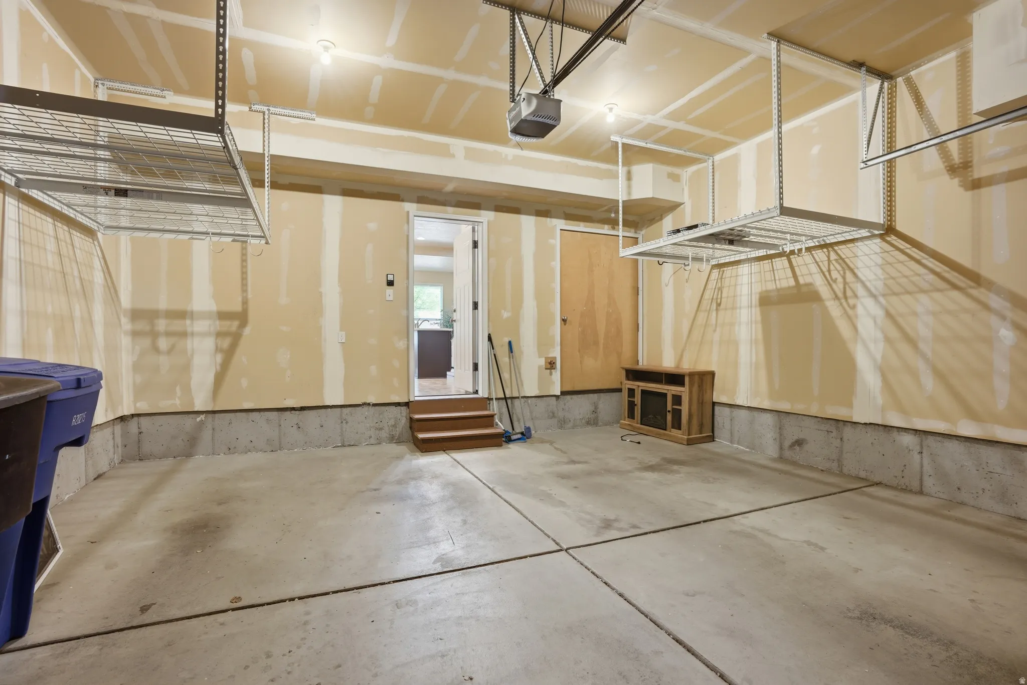 Garage featuring a garage door opener