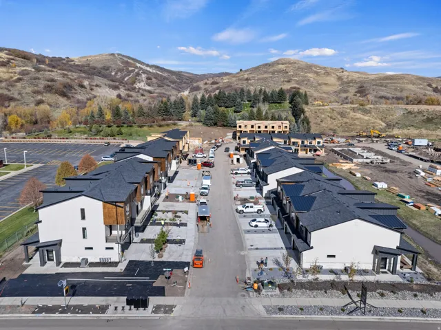 Aerial perspective of suburban area with a mountain backdrop