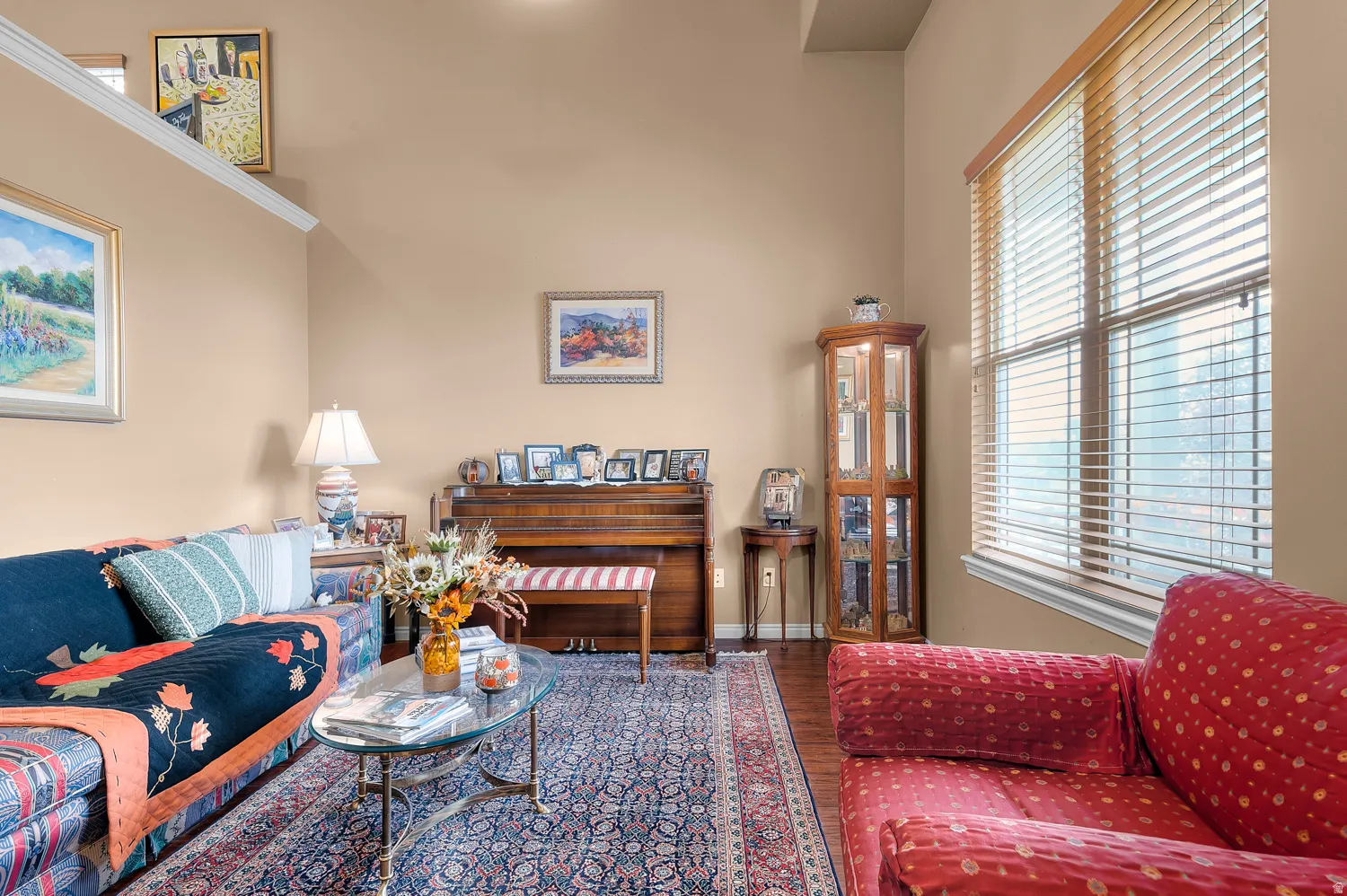 Living area with wood finished floors and baseboards