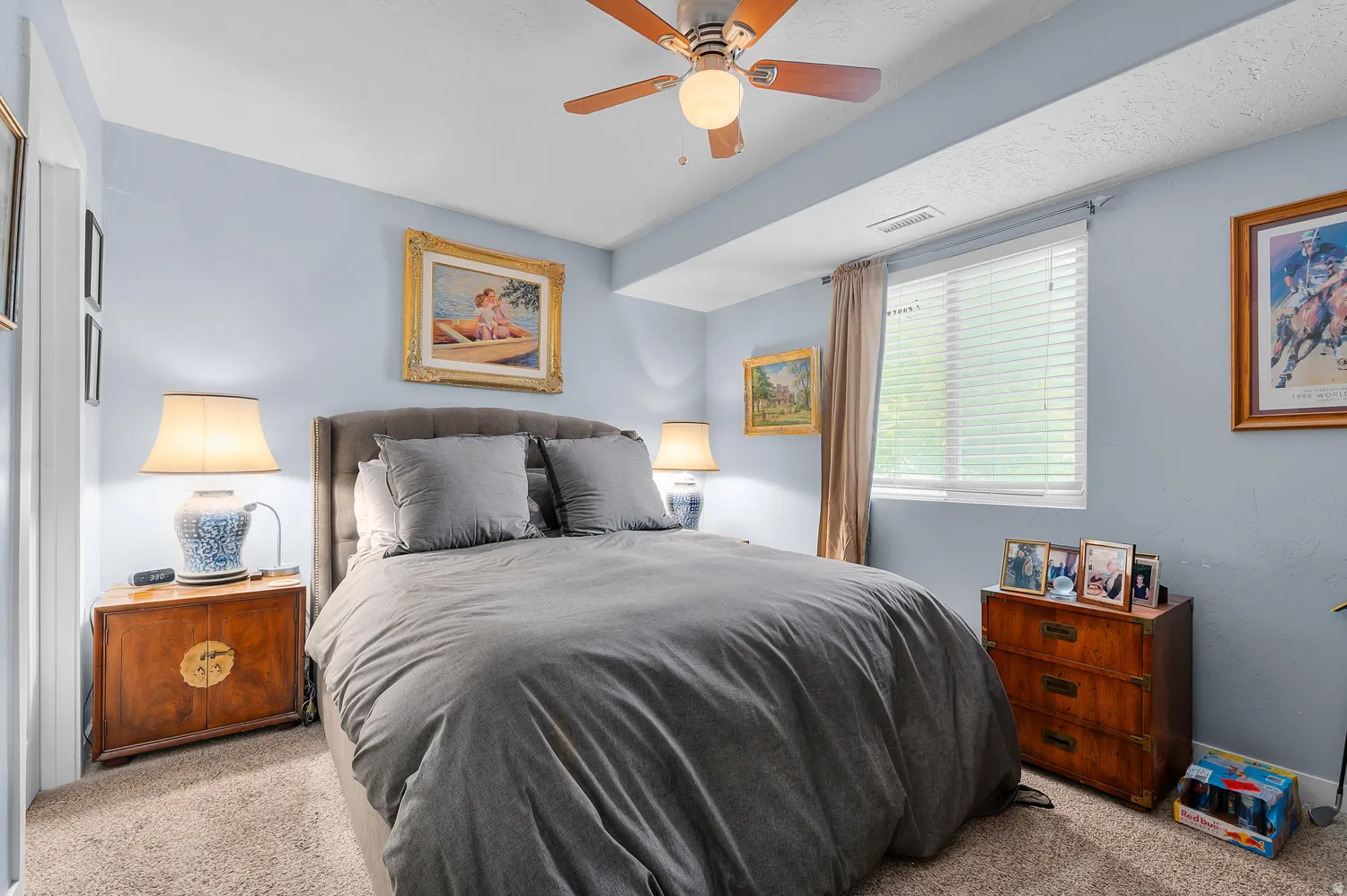 Bedroom featuring light colored carpet and ceiling fan