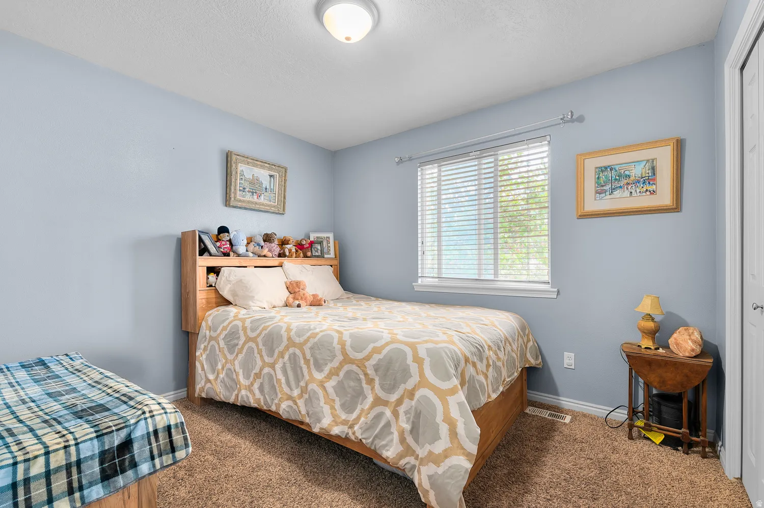 Carpeted bedroom featuring baseboards