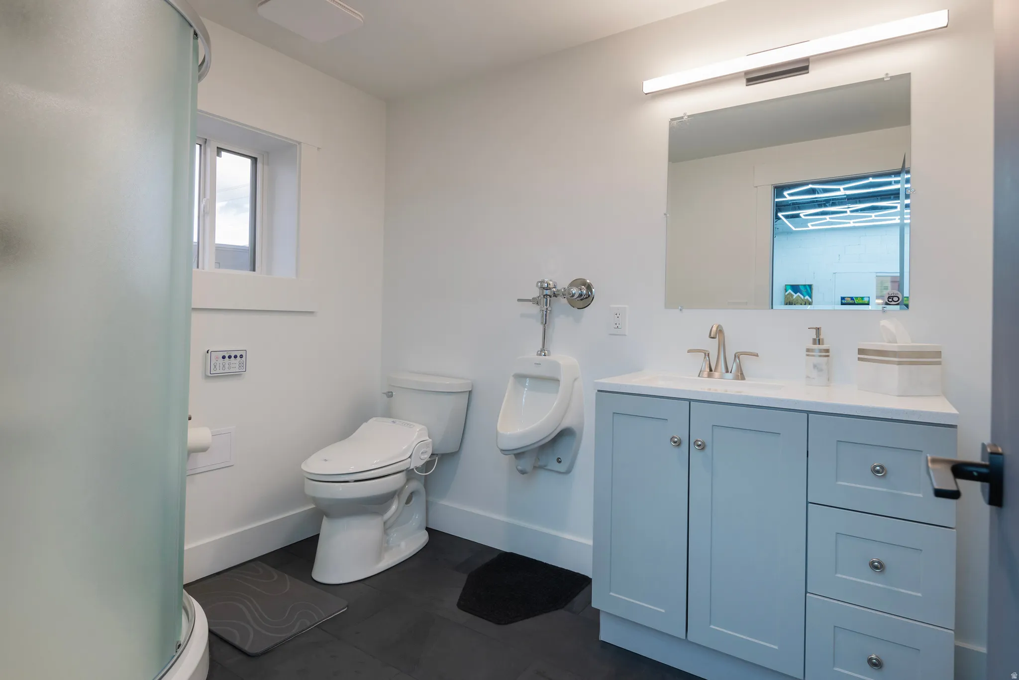 Bathroom featuring vanity and a stall shower