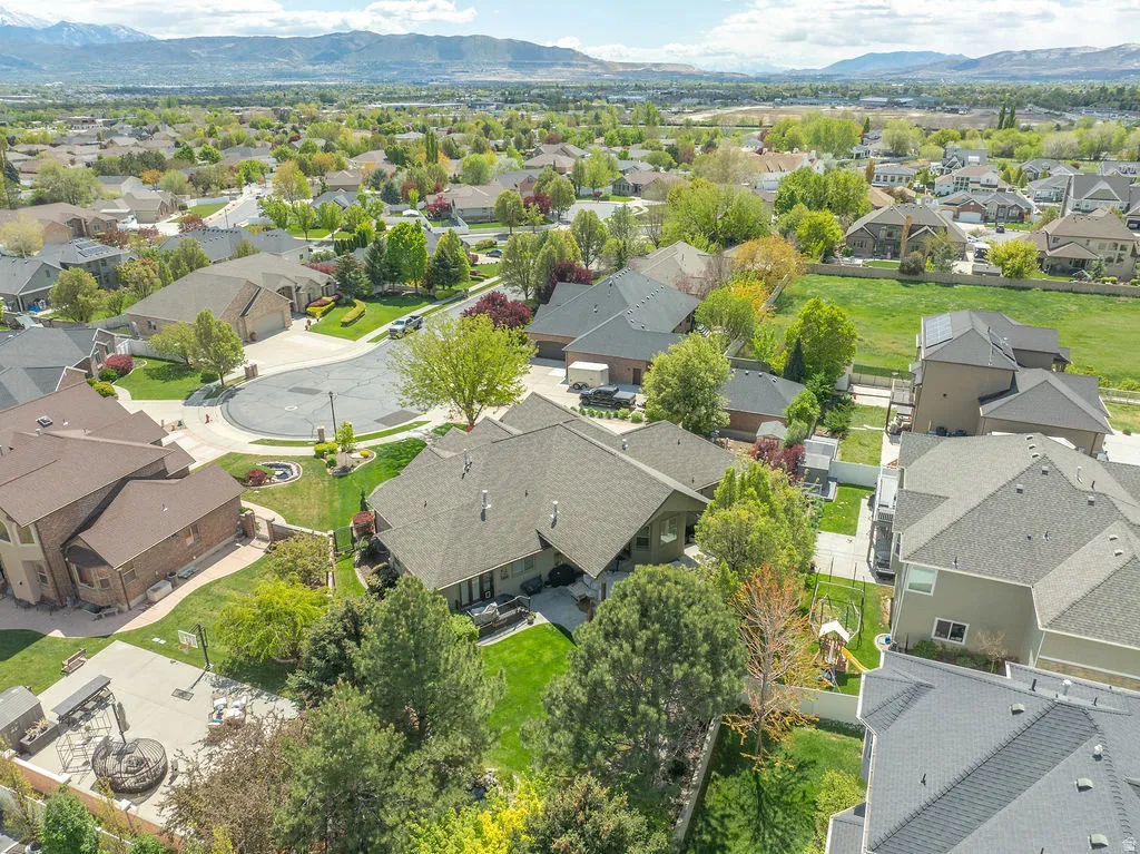 Aerial view of residential area featuring a mountain backdrop
