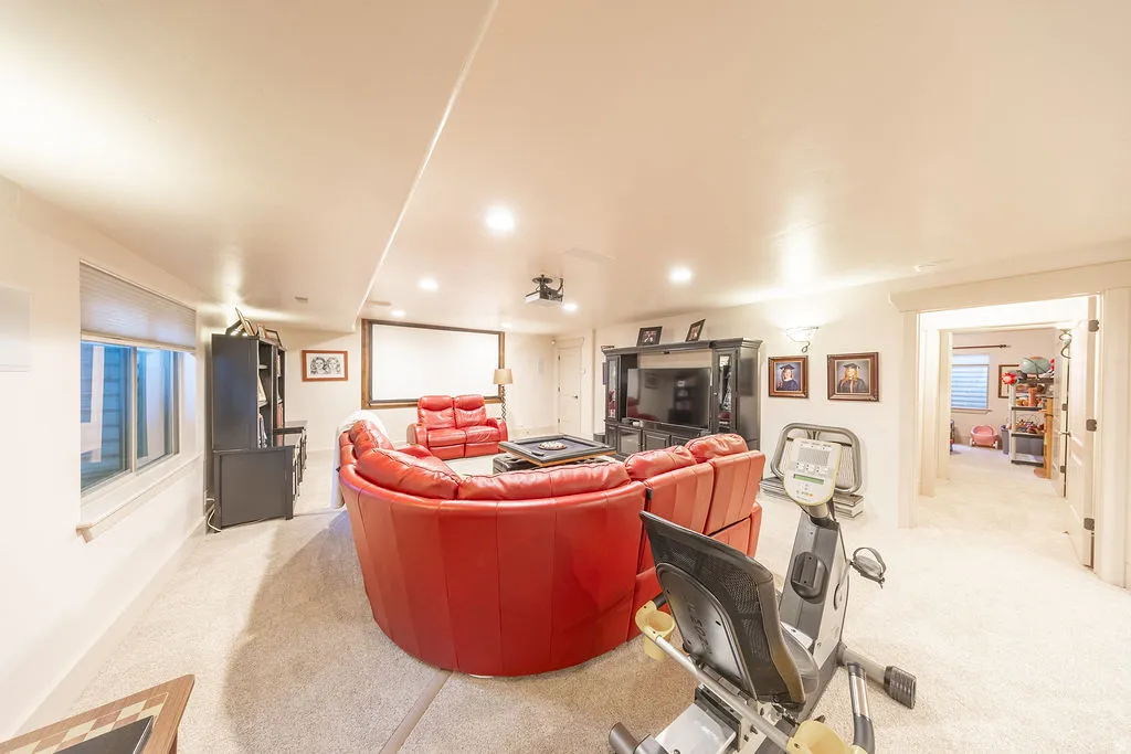 Living area featuring light carpet and recessed lighting