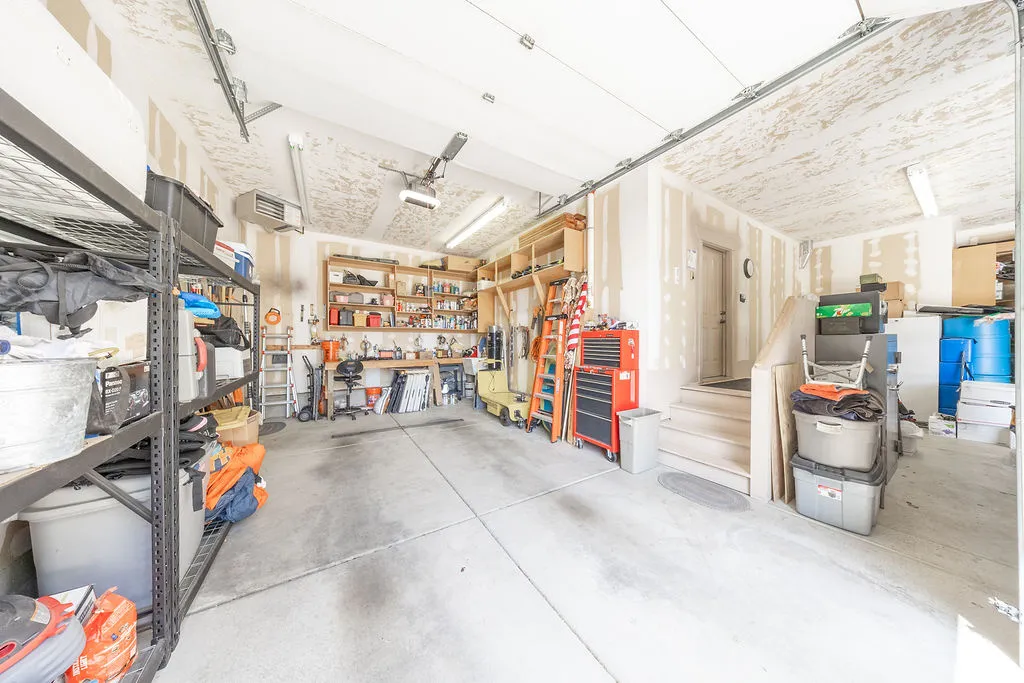 Garage with a workshop area and a heating unit