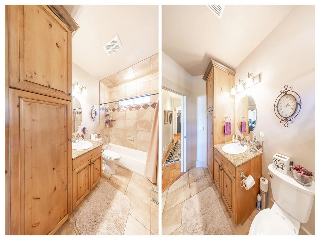 Bathroom featuring vanity, shower / tub combo with curtain, and light tile patterned flooring