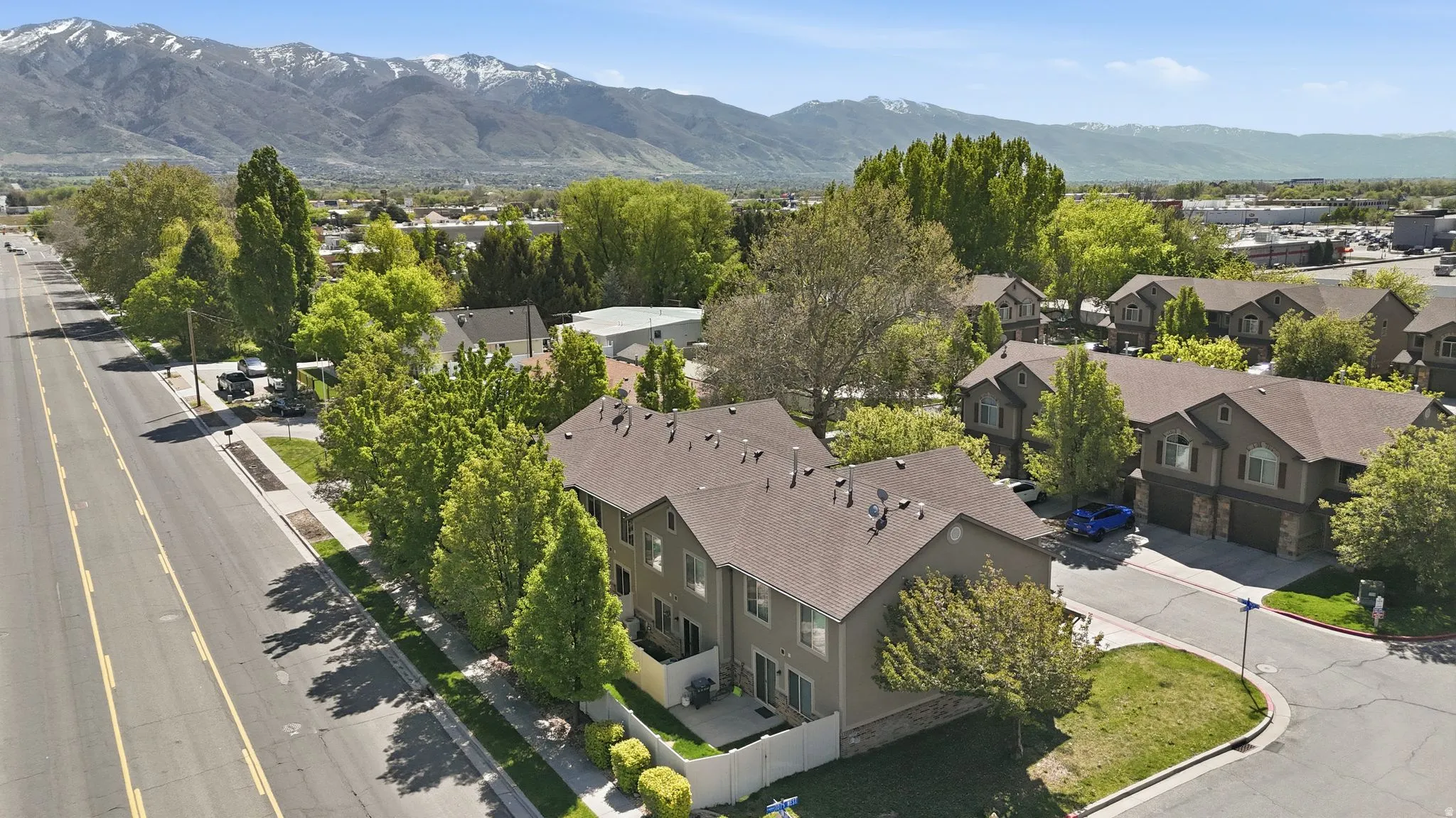 Aerial view of residential area featuring mountains