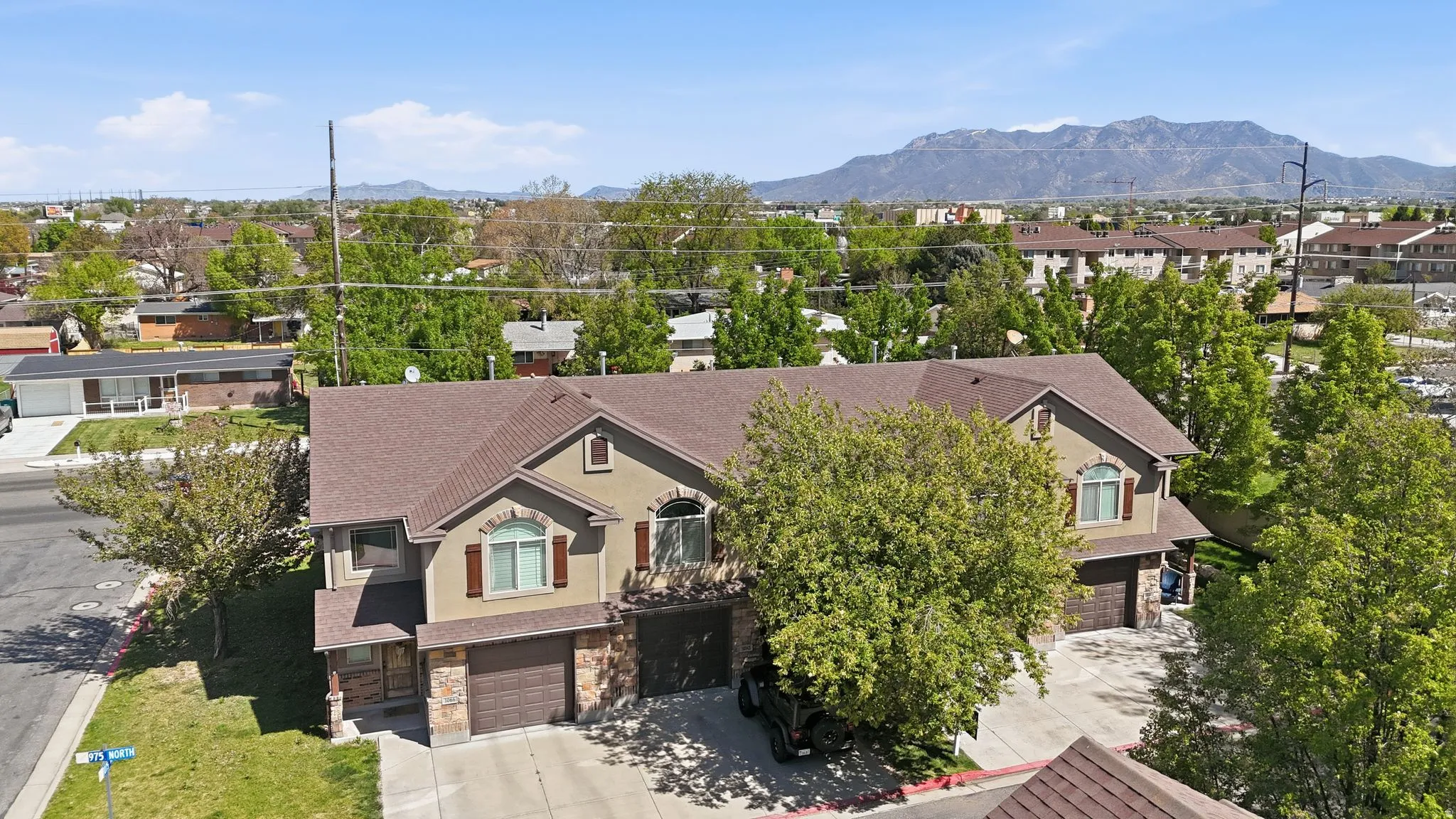 Aerial view of residential area with a mountain backdrop