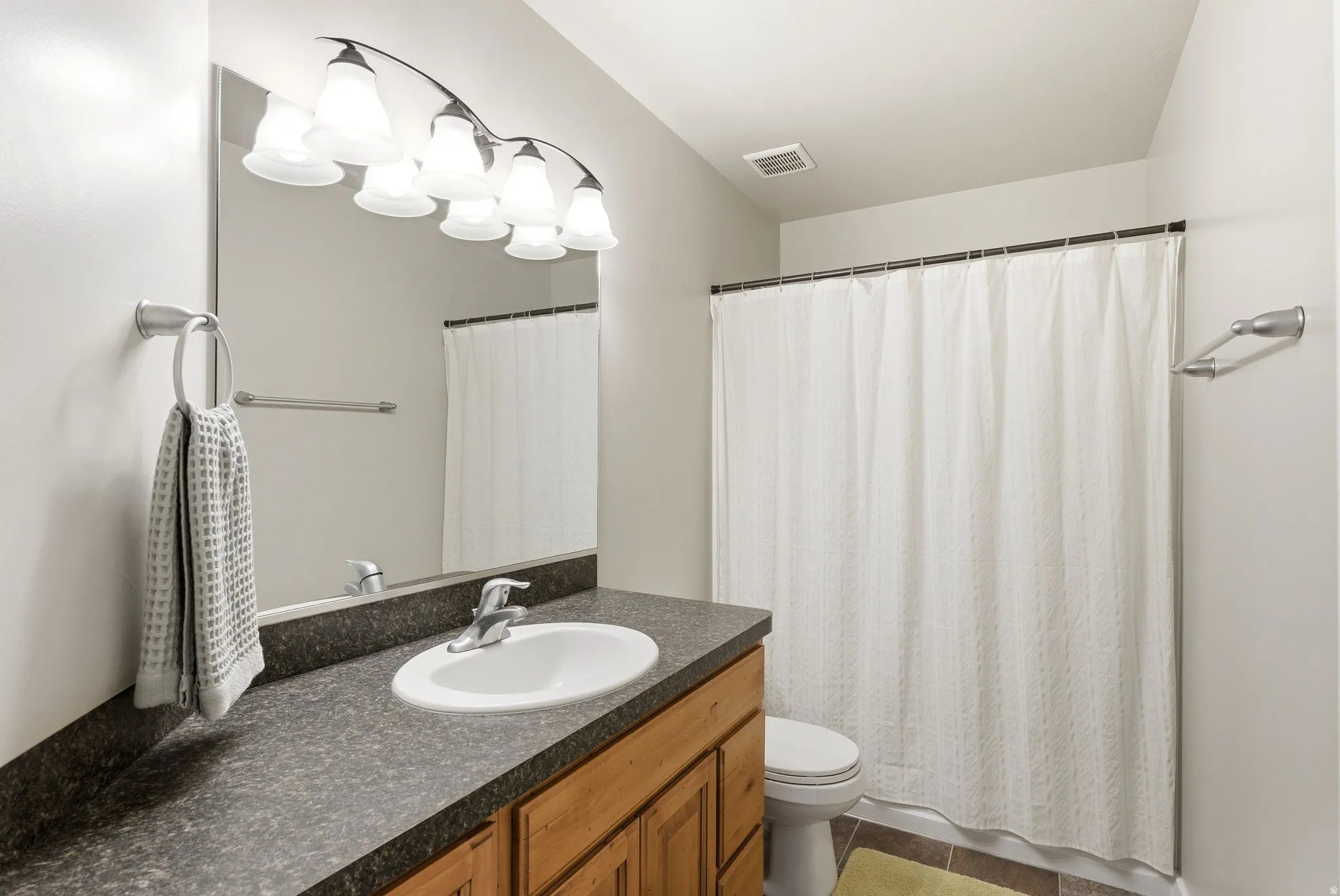 Full bath with vanity and toilet