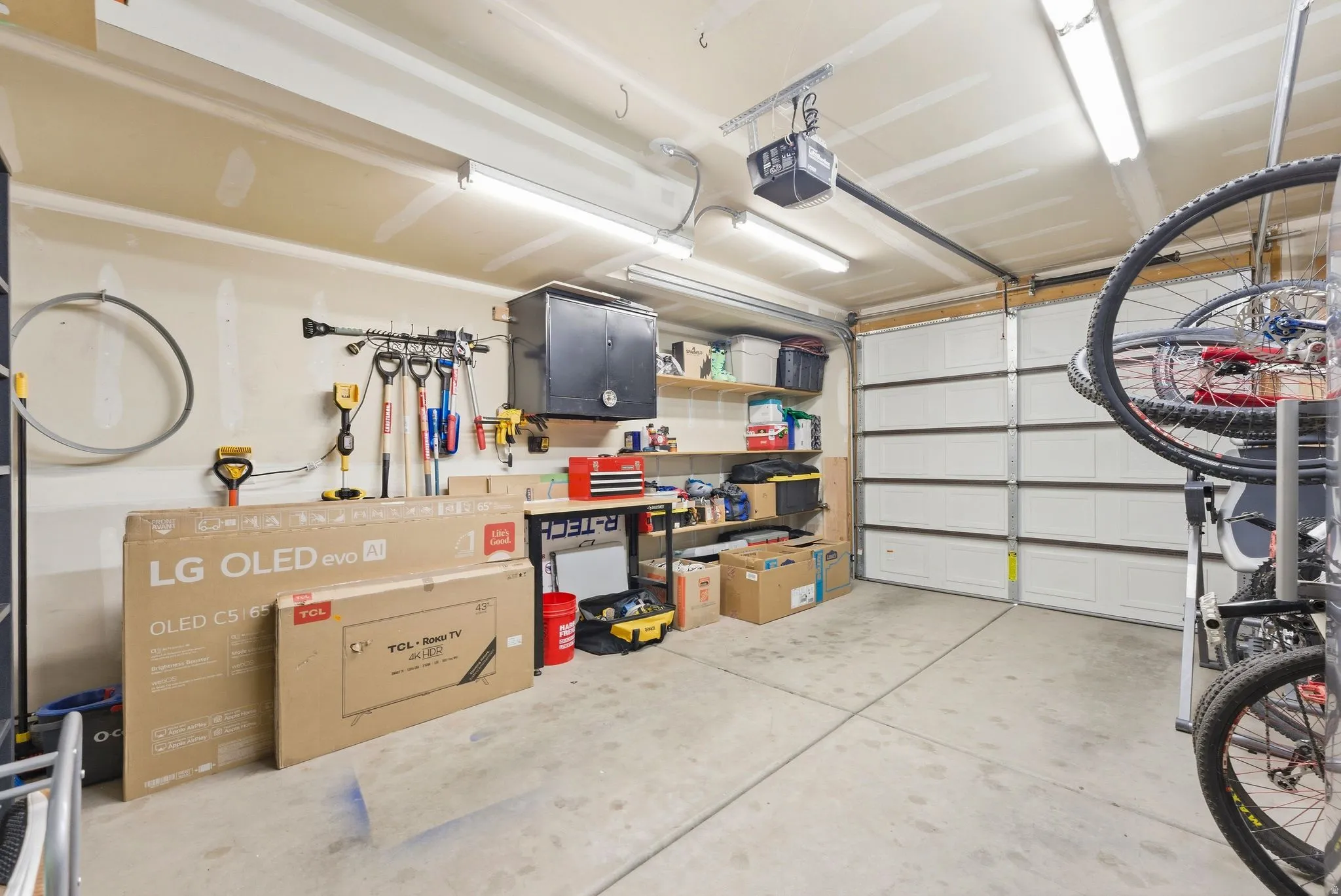 Garage featuring a garage door opener